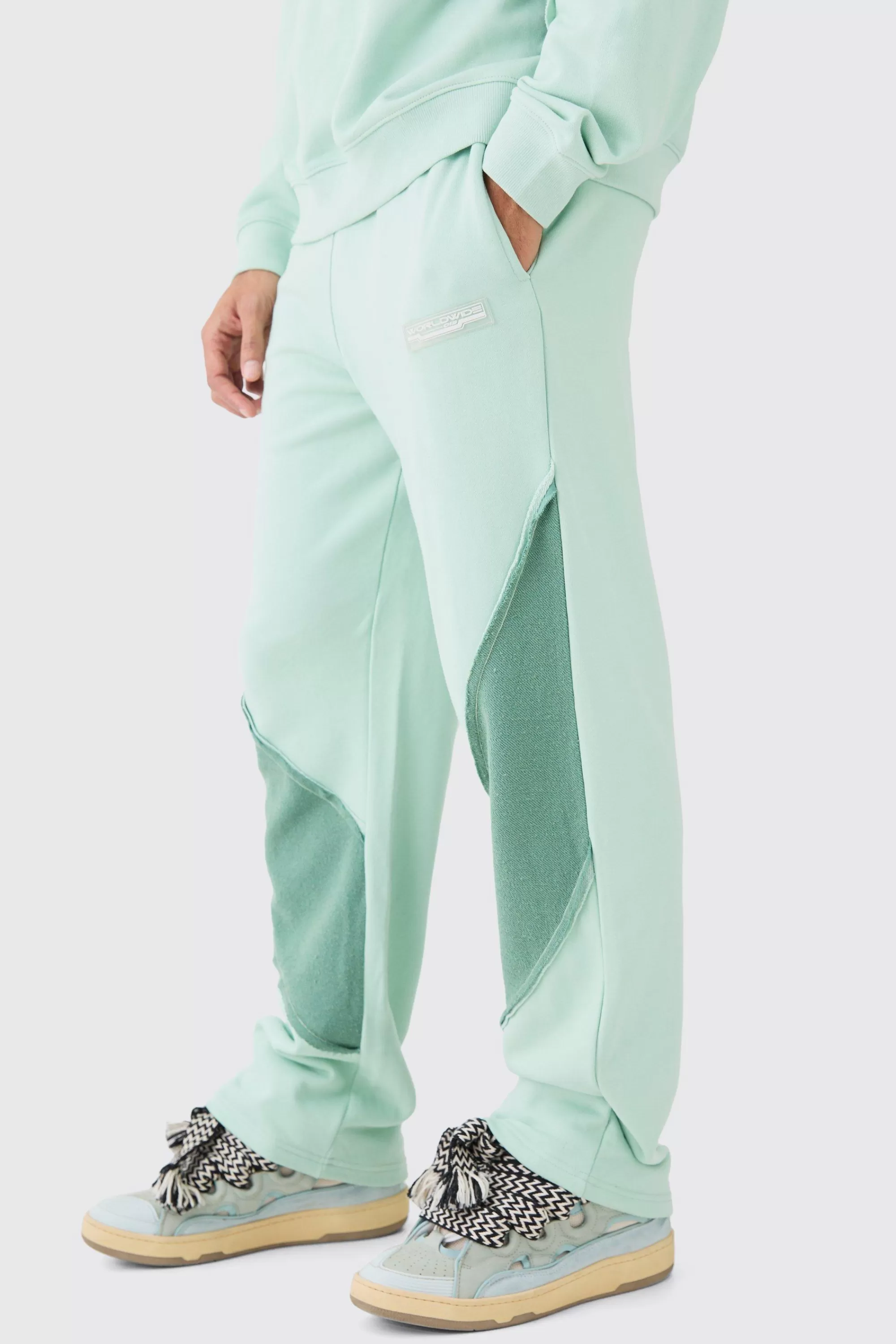 boohooMAN Relaxed Loop Back Raw Hem Panel Jogger | UK