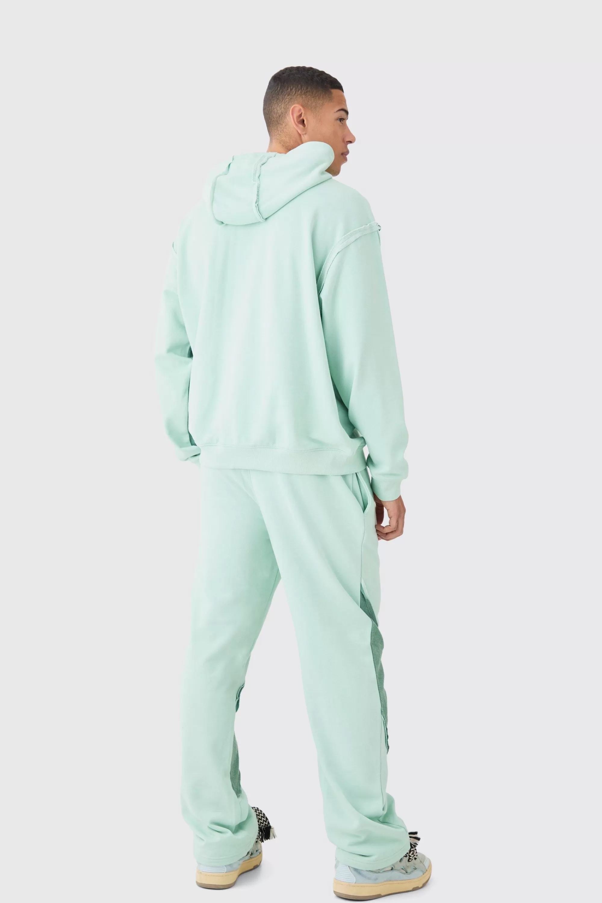 boohooMAN Relaxed Loop Back Raw Hem Panel Jogger | UK