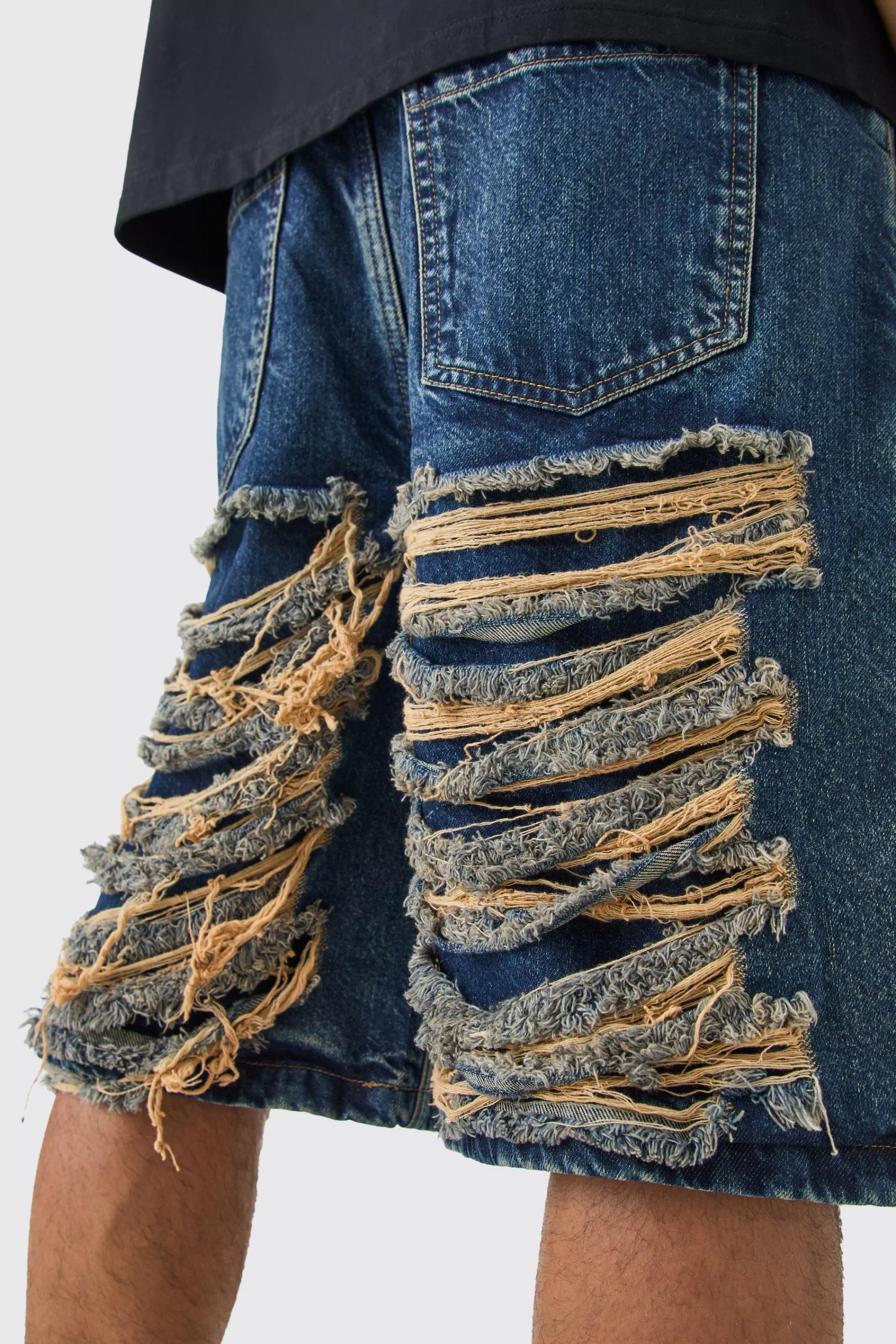boohooMAN Relaxed Rigid Extreme Ripped Denim Jorts In | UK