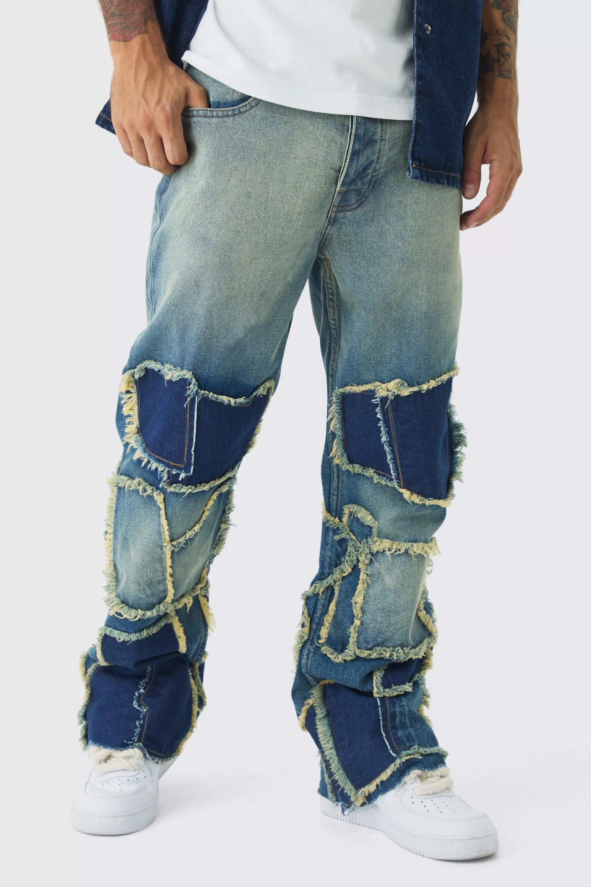 boohooMAN Relaxed Rigid Flare Patchwork Distressed Jeans | UK