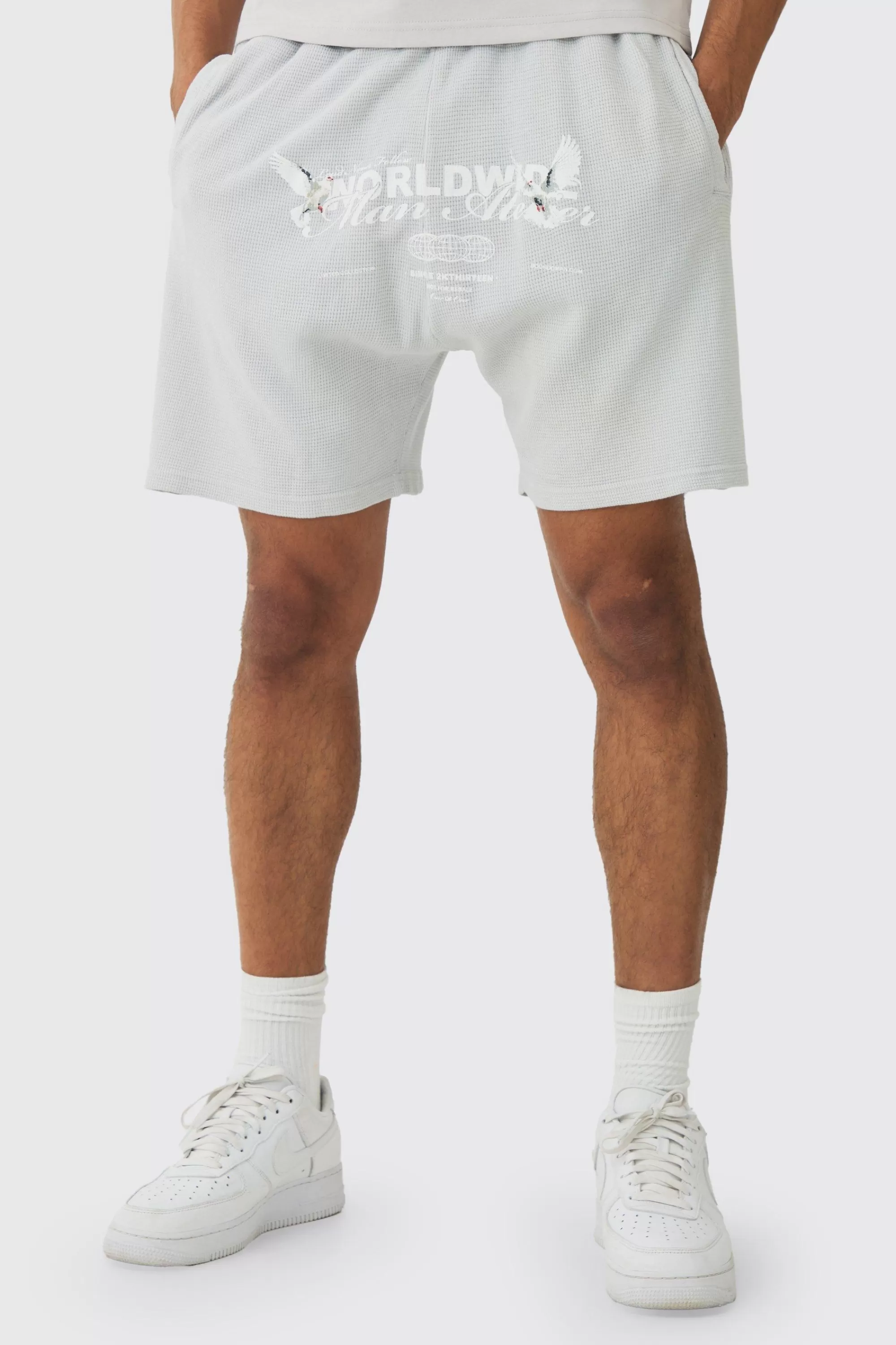 boohooMAN Relaxed Washed Heavyweight Graphic Waffle Shorts | UK