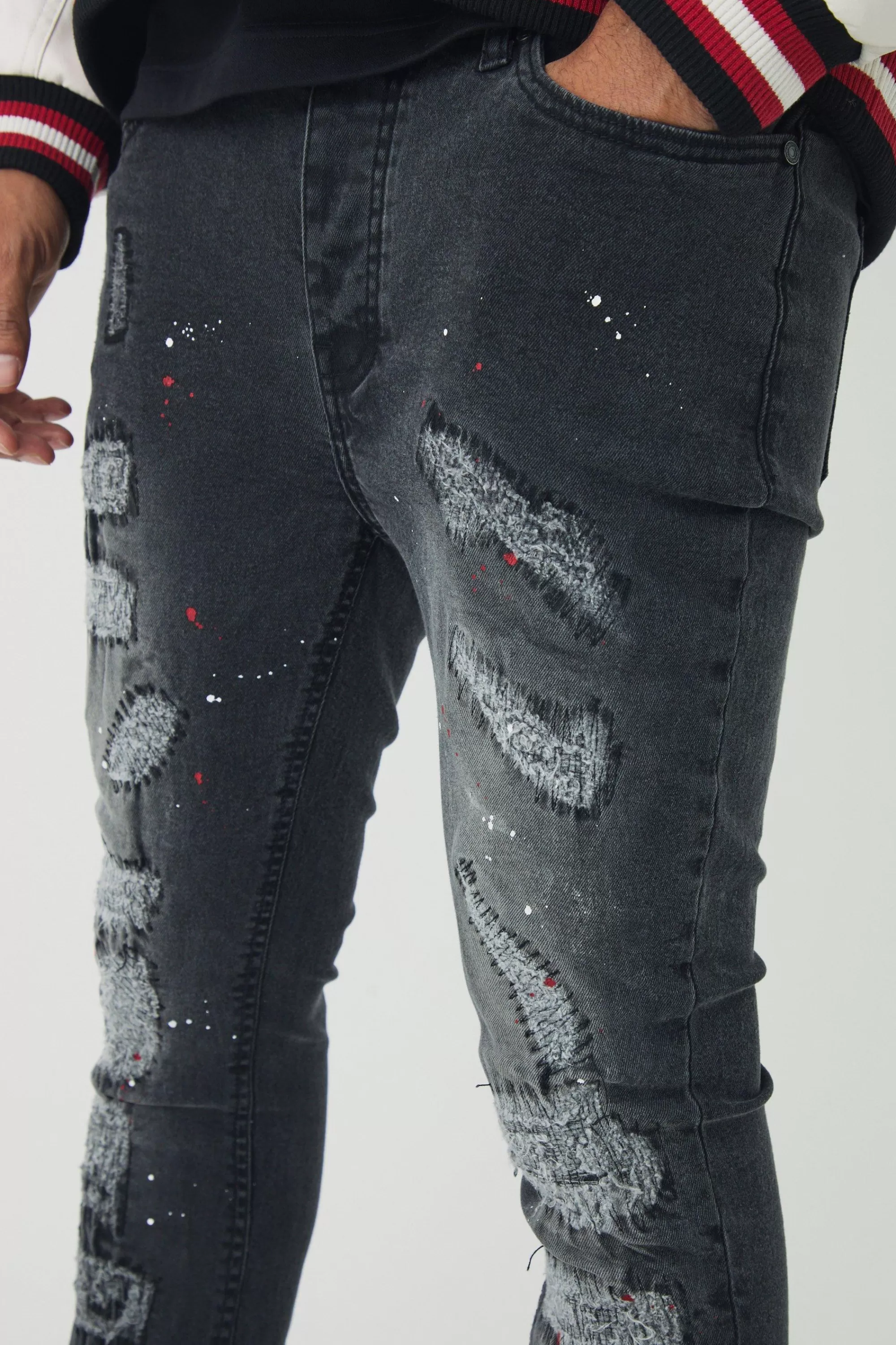 boohooMAN Skinny Flared Ripped Stitch Detail Paint Splatter Jeans | UK
