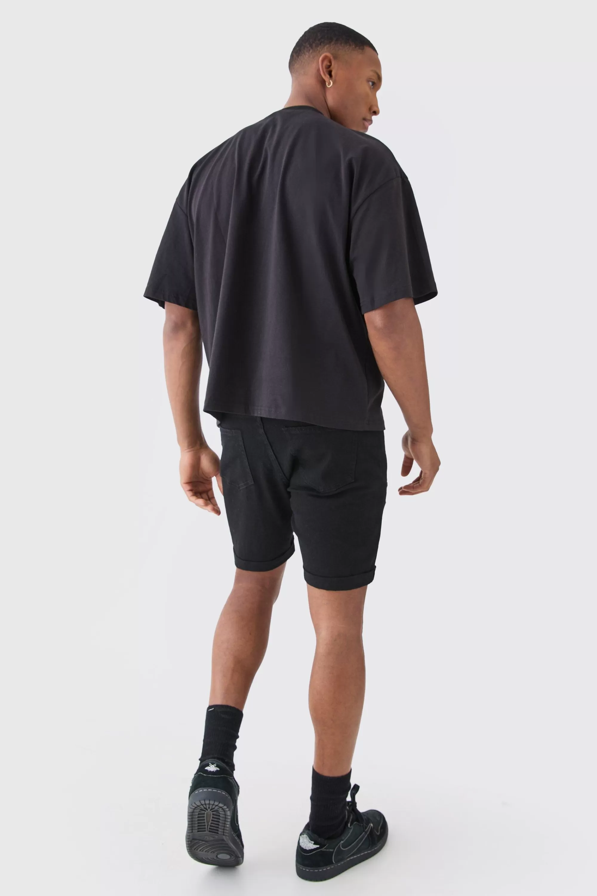 boohooMAN Skinny Stretch Distressed Denim Shorts In Black | UK