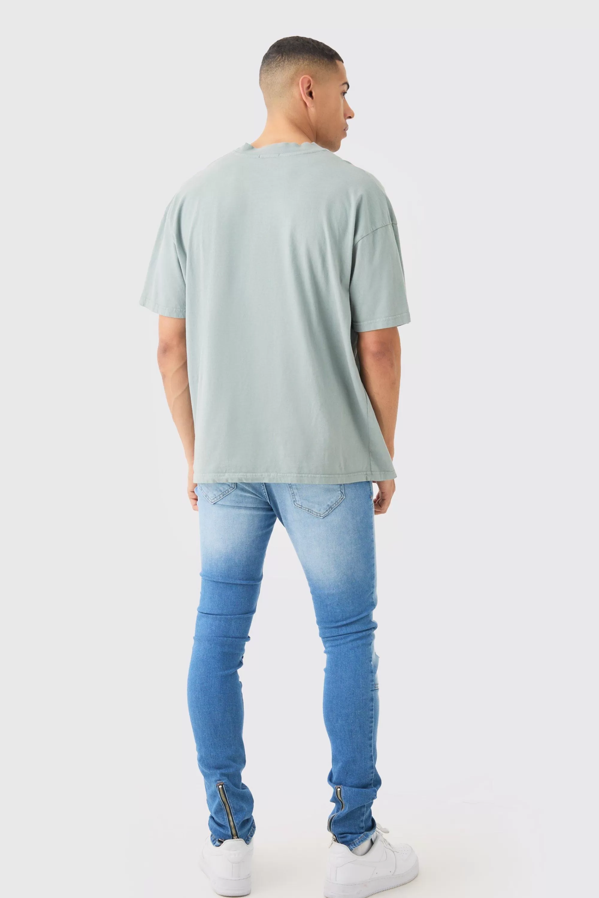 boohooMAN Skinny Stretch Stacked Ripped Carpenter Zip Hem Jeans In | UK