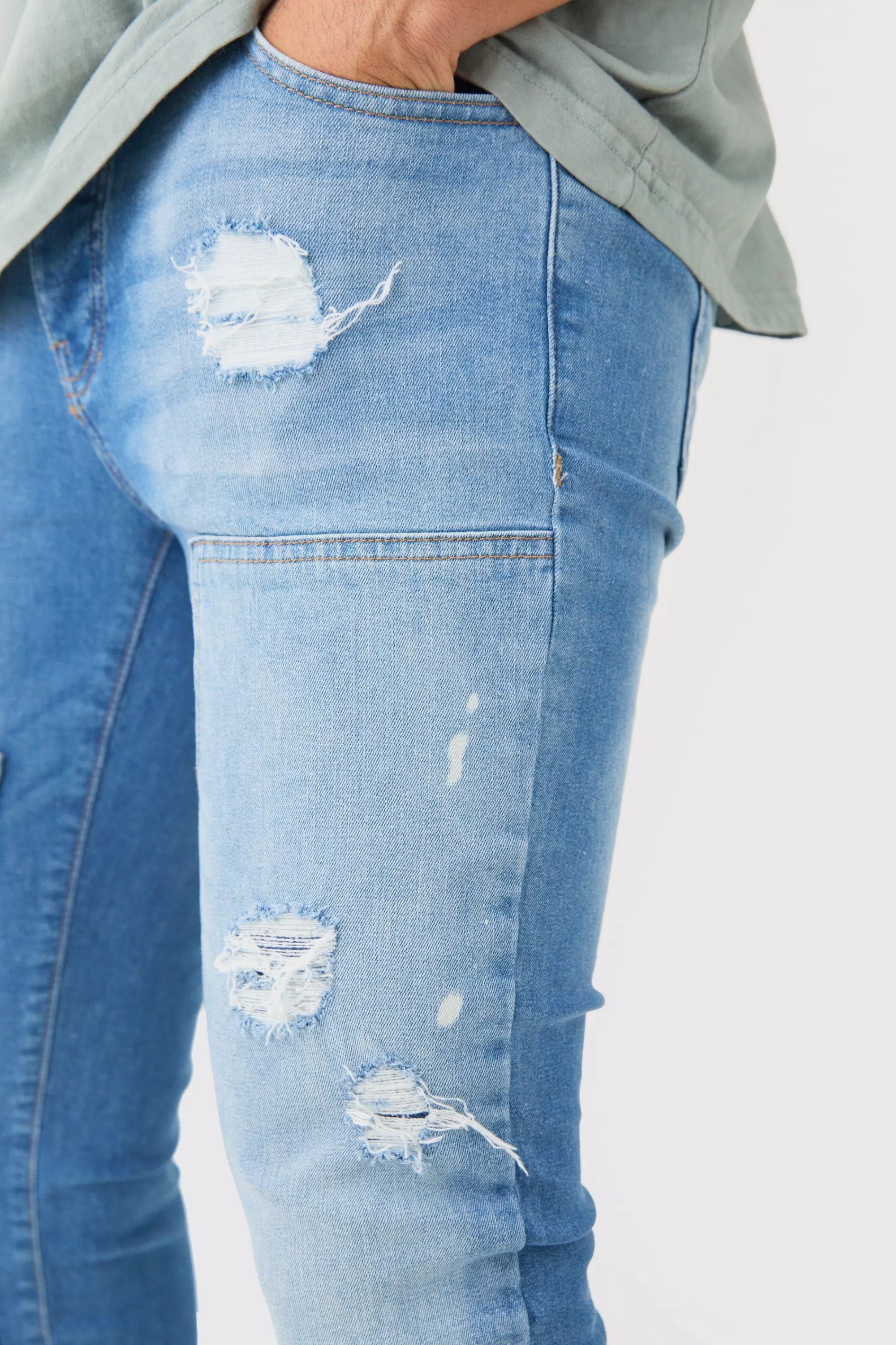 boohooMAN Skinny Stretch Stacked Ripped Carpenter Zip Hem Jeans In | UK