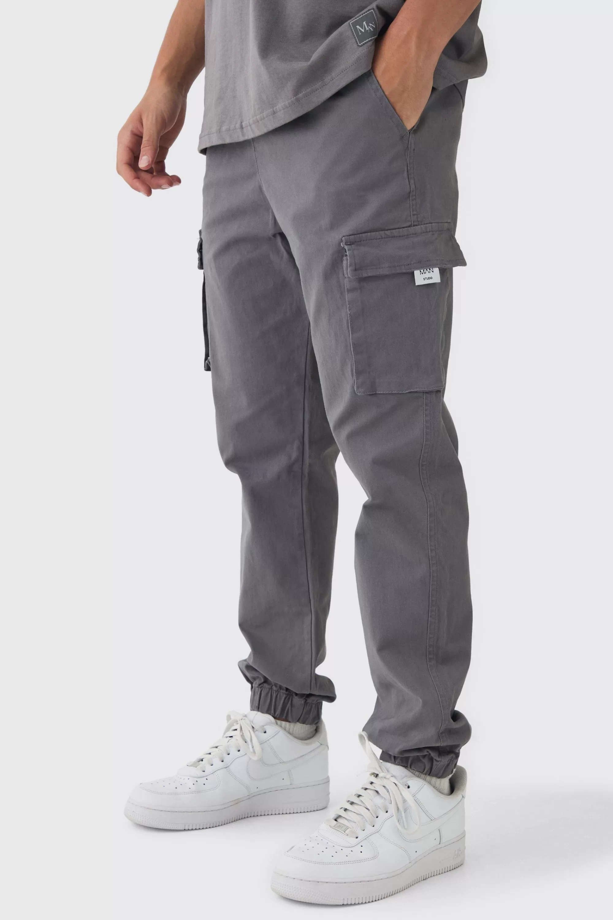 boohooMAN Slim Fit Elasticated Waist Woven Tab Cuffed Cargo Trousers | UK