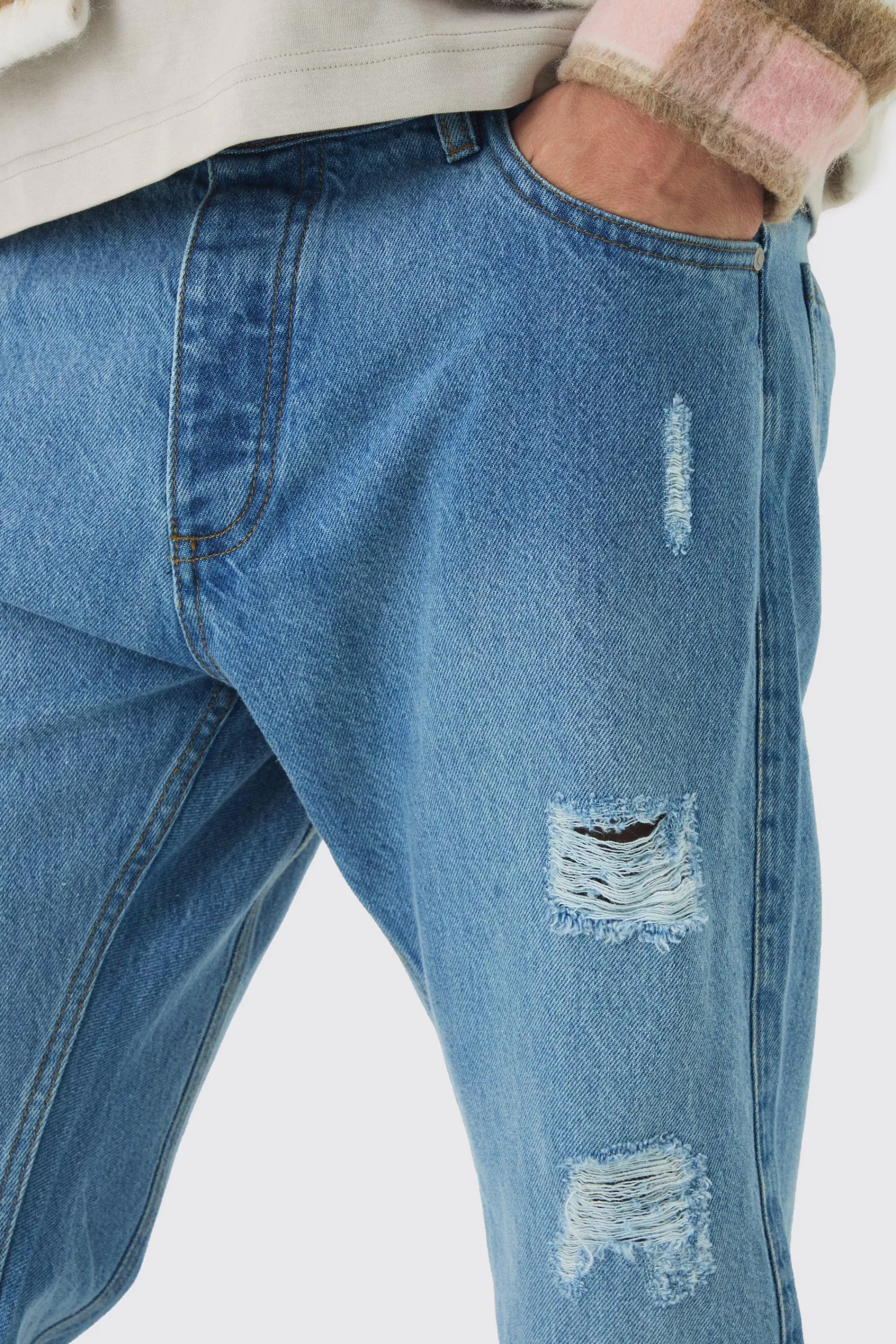 boohooMAN Slim Fit Flared Ripped Knee Jeans With Let Down Hem | UK