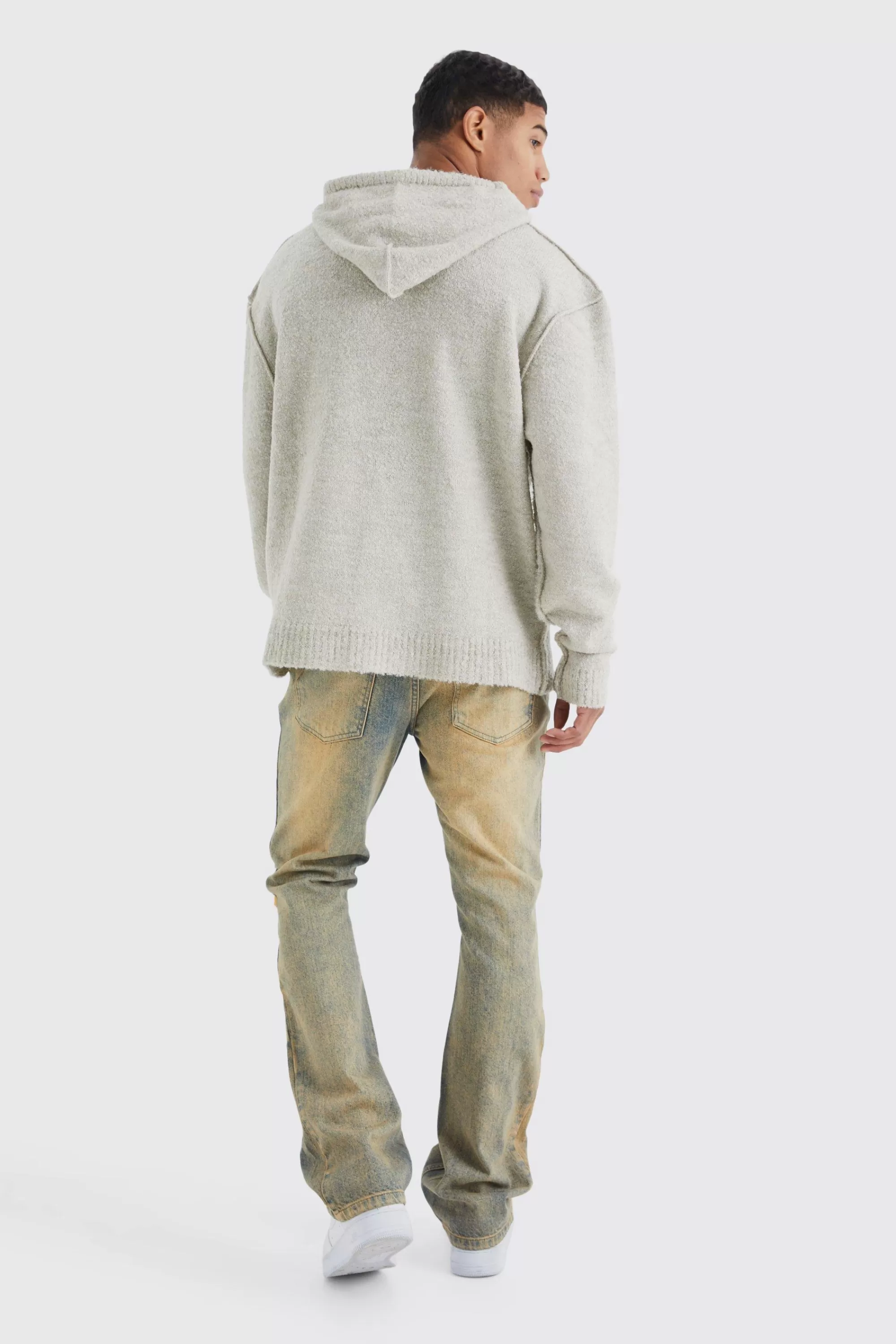 boohooMAN Slim Flare Rigid Multi Rip & Repair Jean | UK