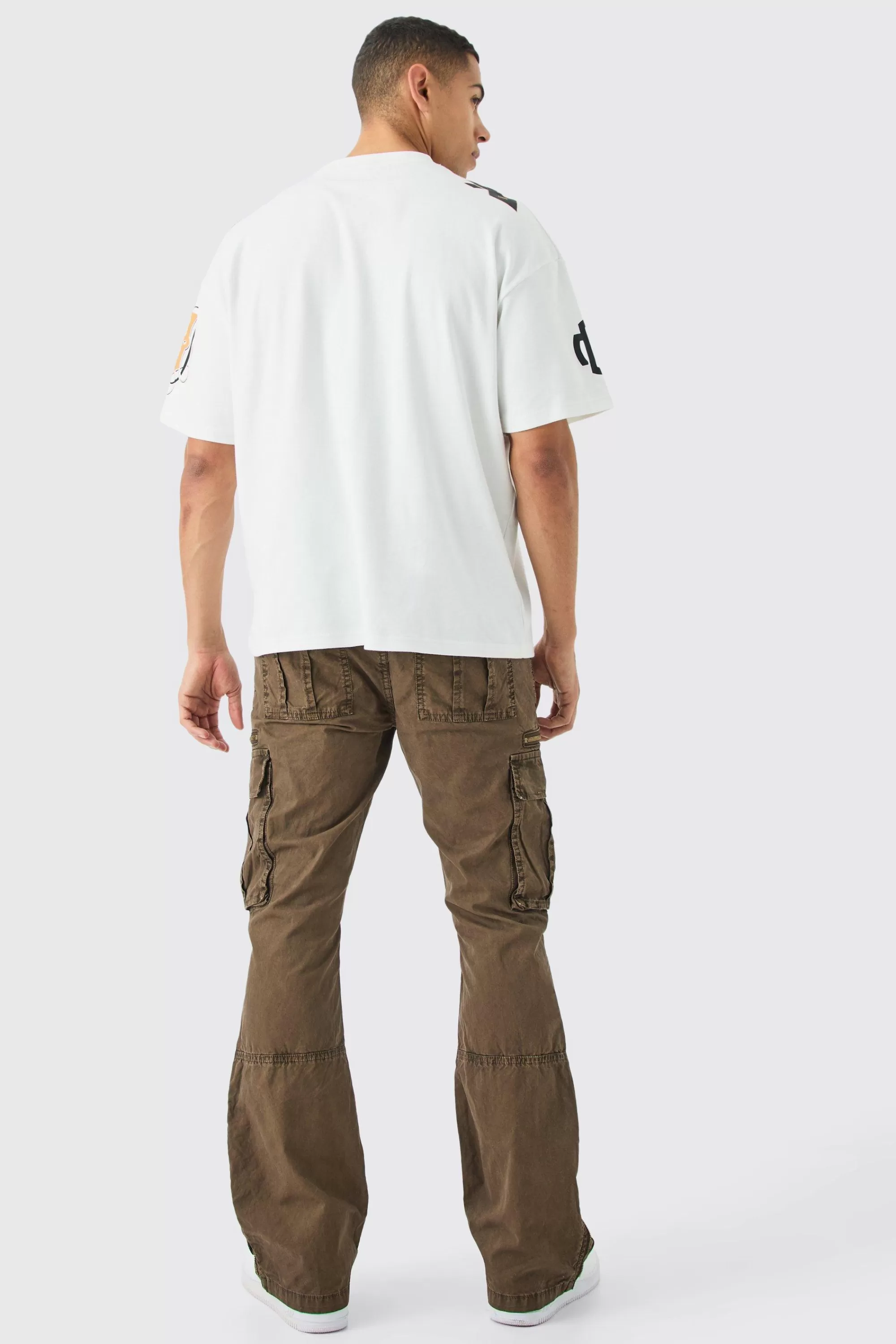 boohooMAN Slim Flare Zip Gusset Overdye Acid Wash Cargo Trouser | UK