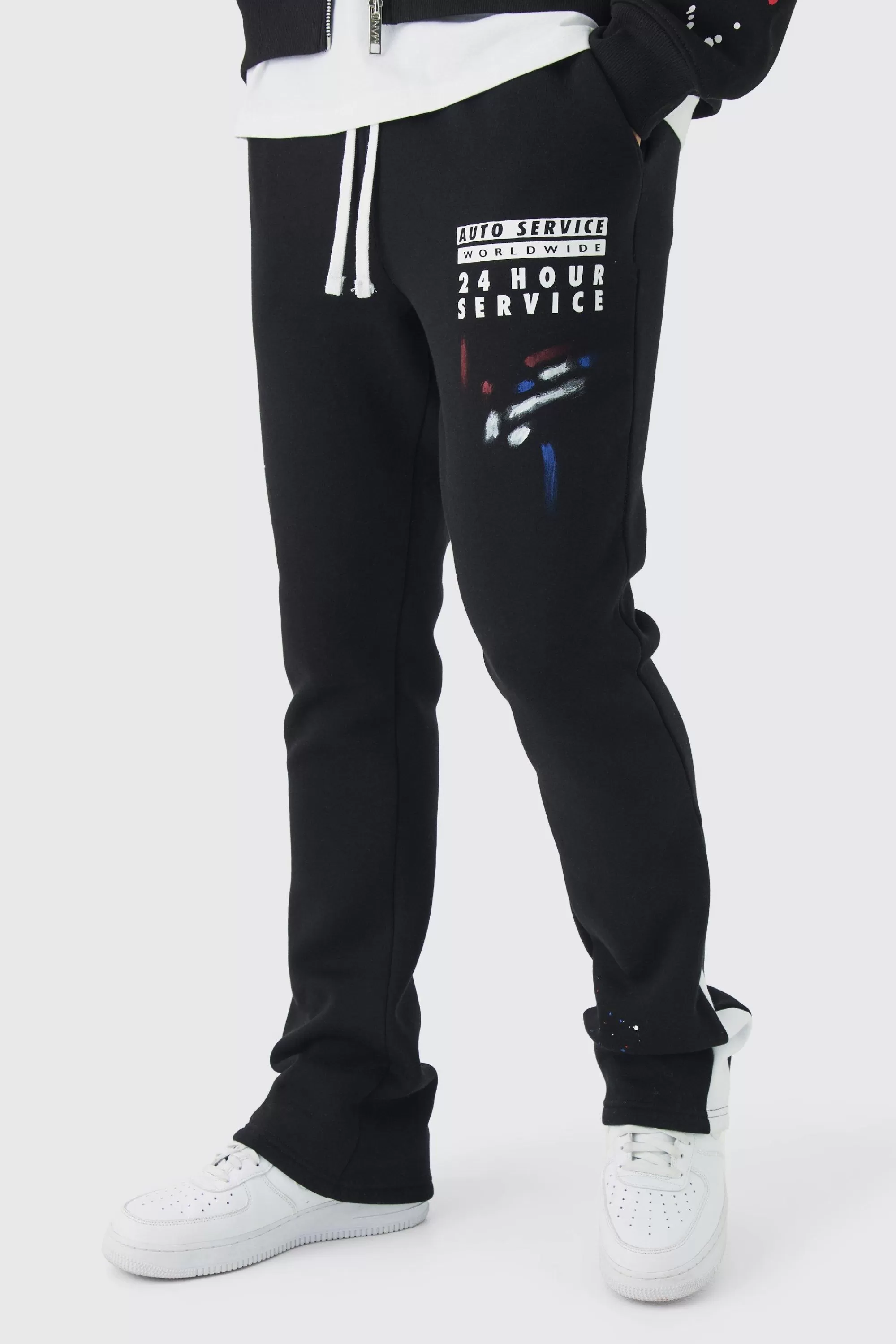 boohooMAN Slim Stacked Flare Paint Splatter Gusset Jogger | UK