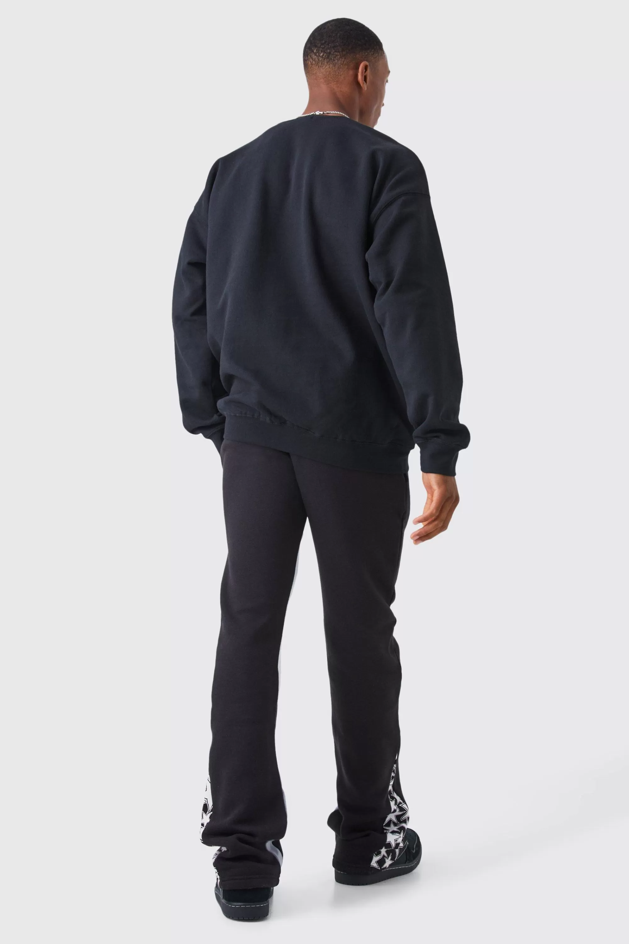 boohooMAN Slim Stacked Flare Star Print Gusset Jogger | UK