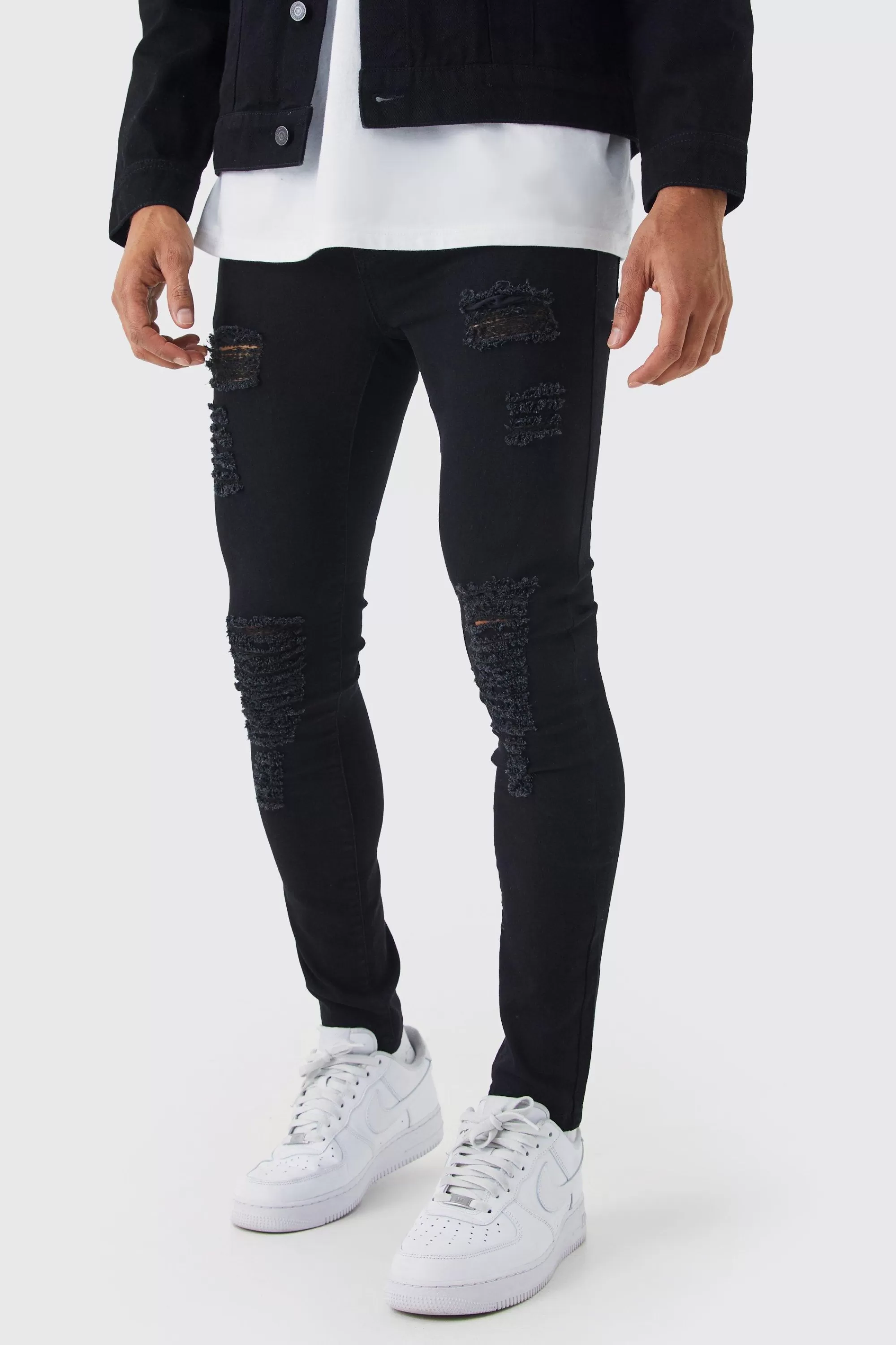 boohooMAN Super Skinny Jeans With All Over Rips | UK