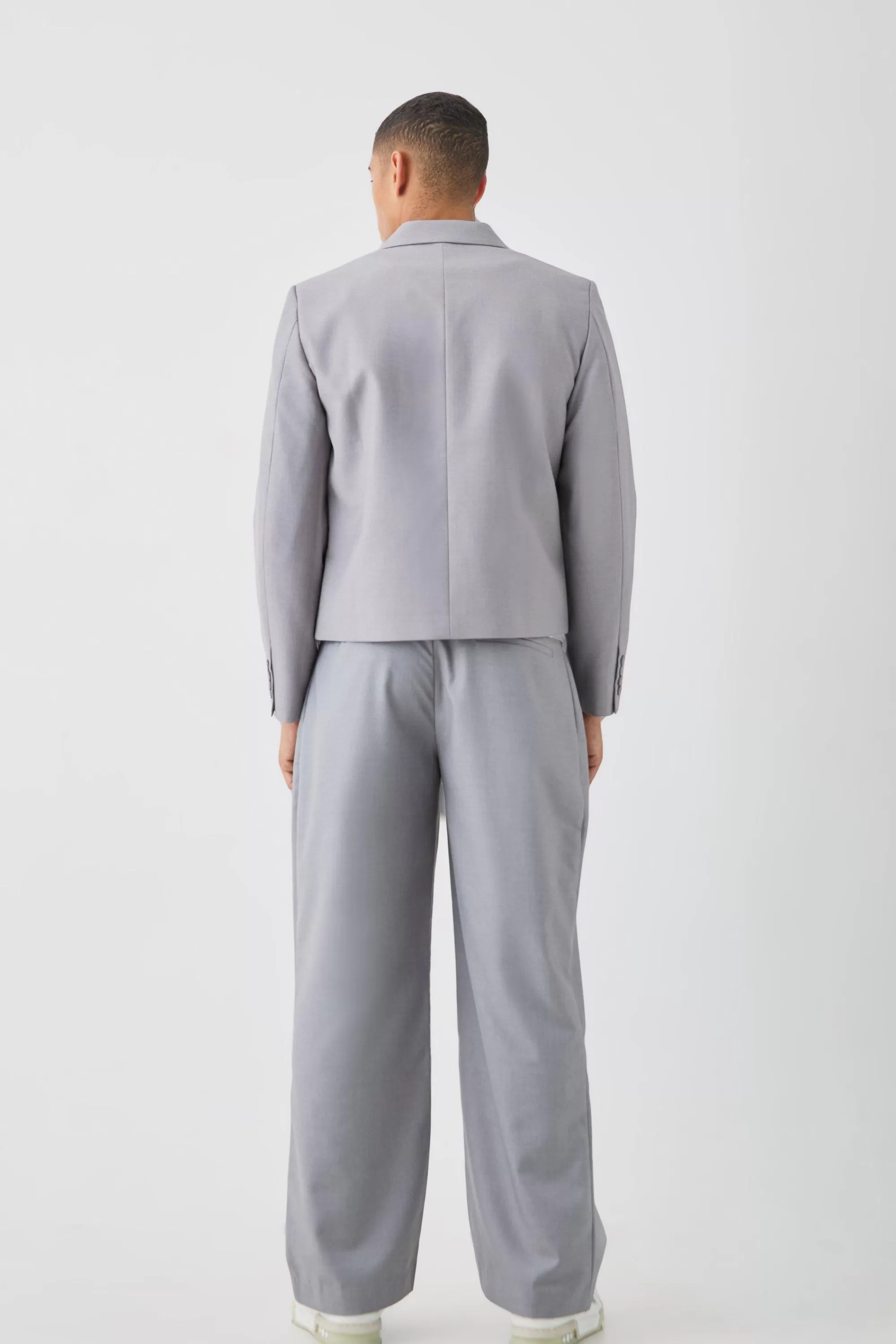 boohooMAN Tailored Fixed Waist Wide Leg Pleated Trouser In | UK