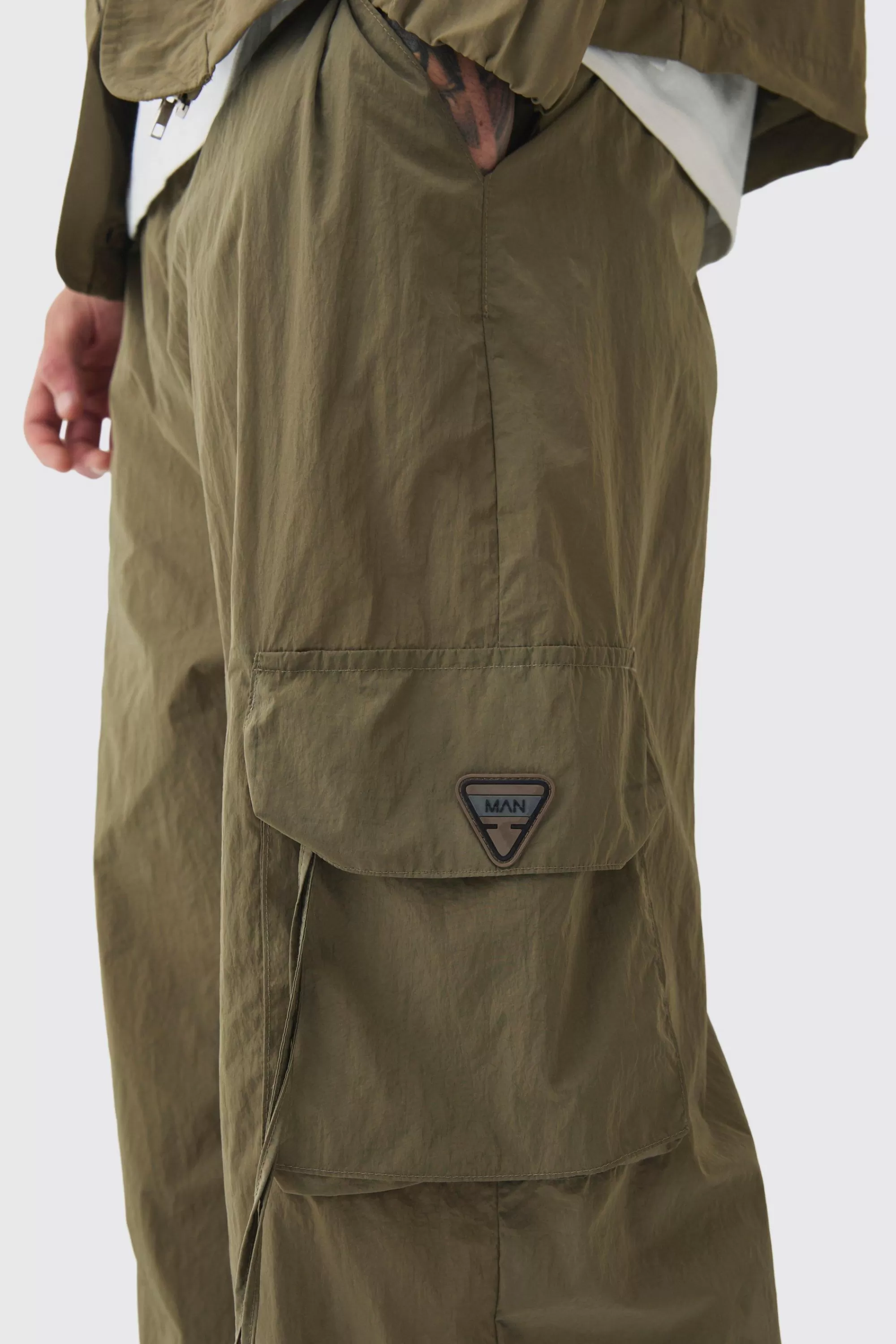 boohooMAN Tall Crinkle Nylon Cargo Parachute Trousers In | UK