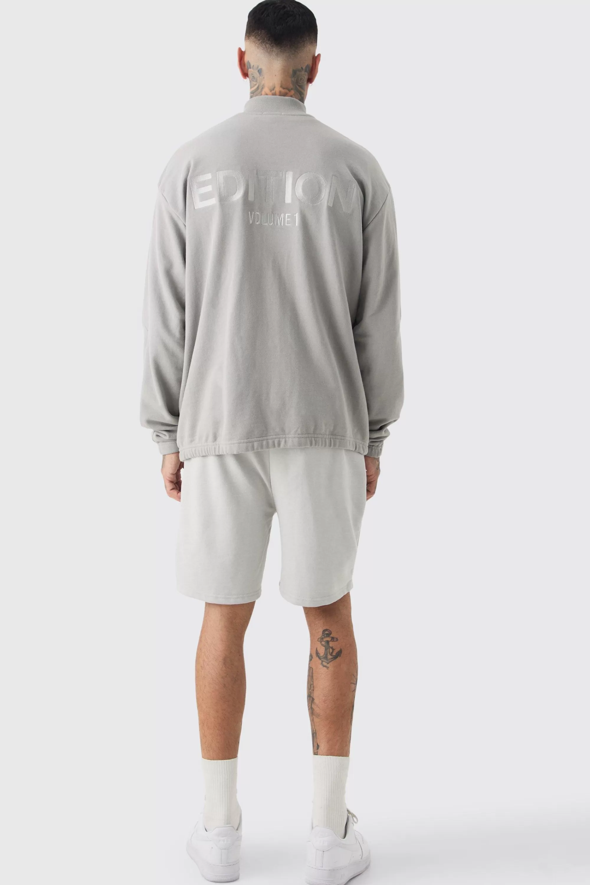 boohooMAN Tall Distressed Applique Loose Short In | UK