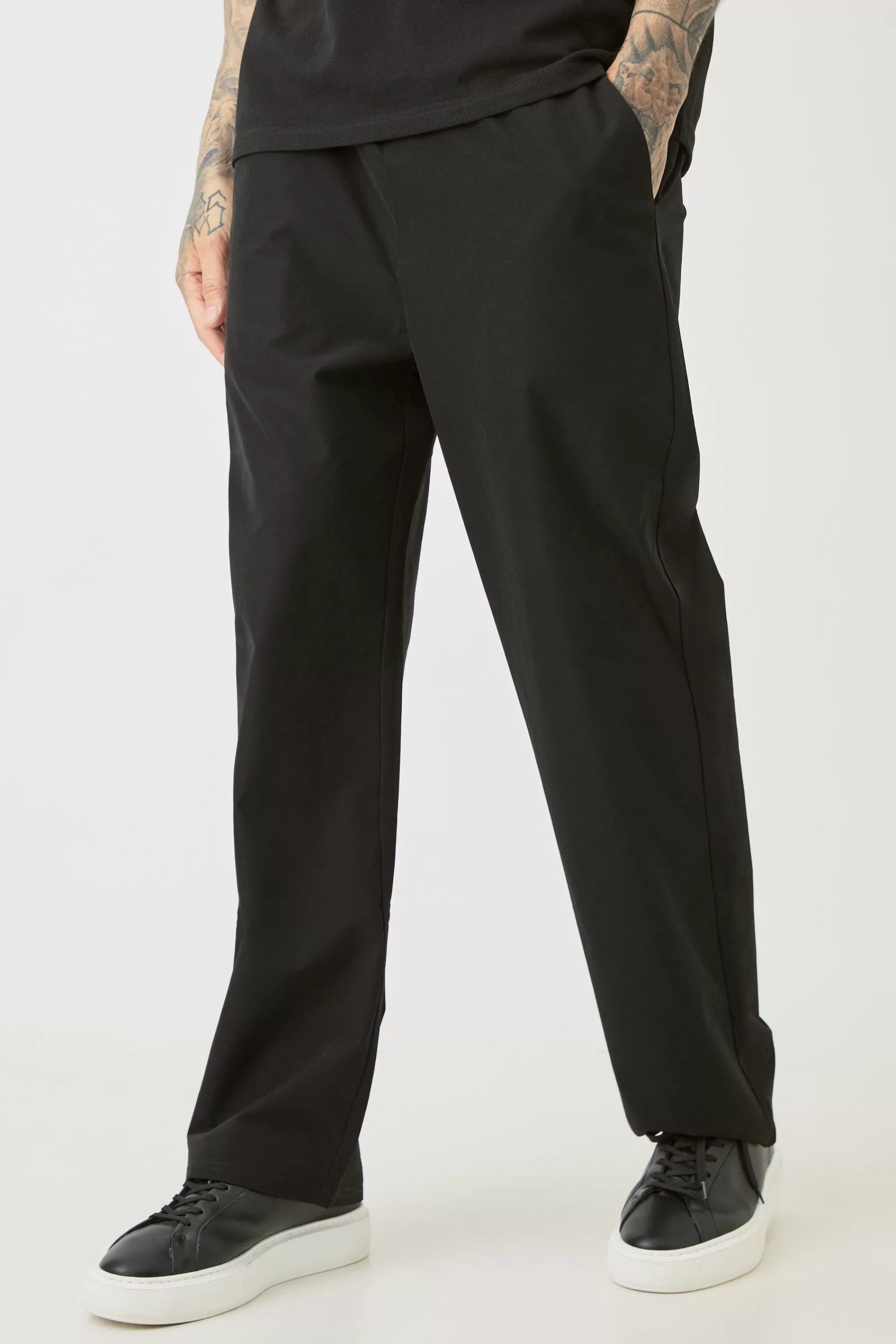 boohooMAN Tall Elasticated Lightweight Technical Stretch Relaxed Fit Trousers | UK