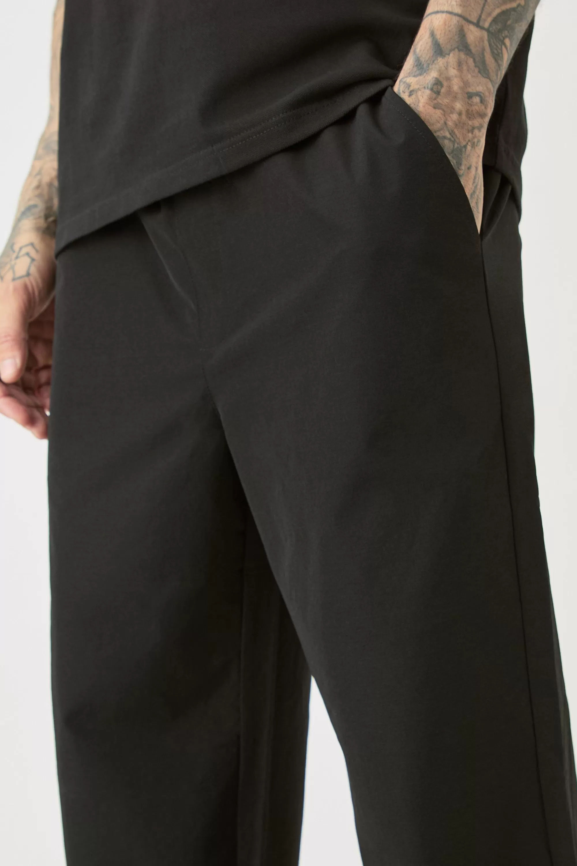 boohooMAN Tall Elasticated Lightweight Technical Stretch Relaxed Fit Trousers | UK
