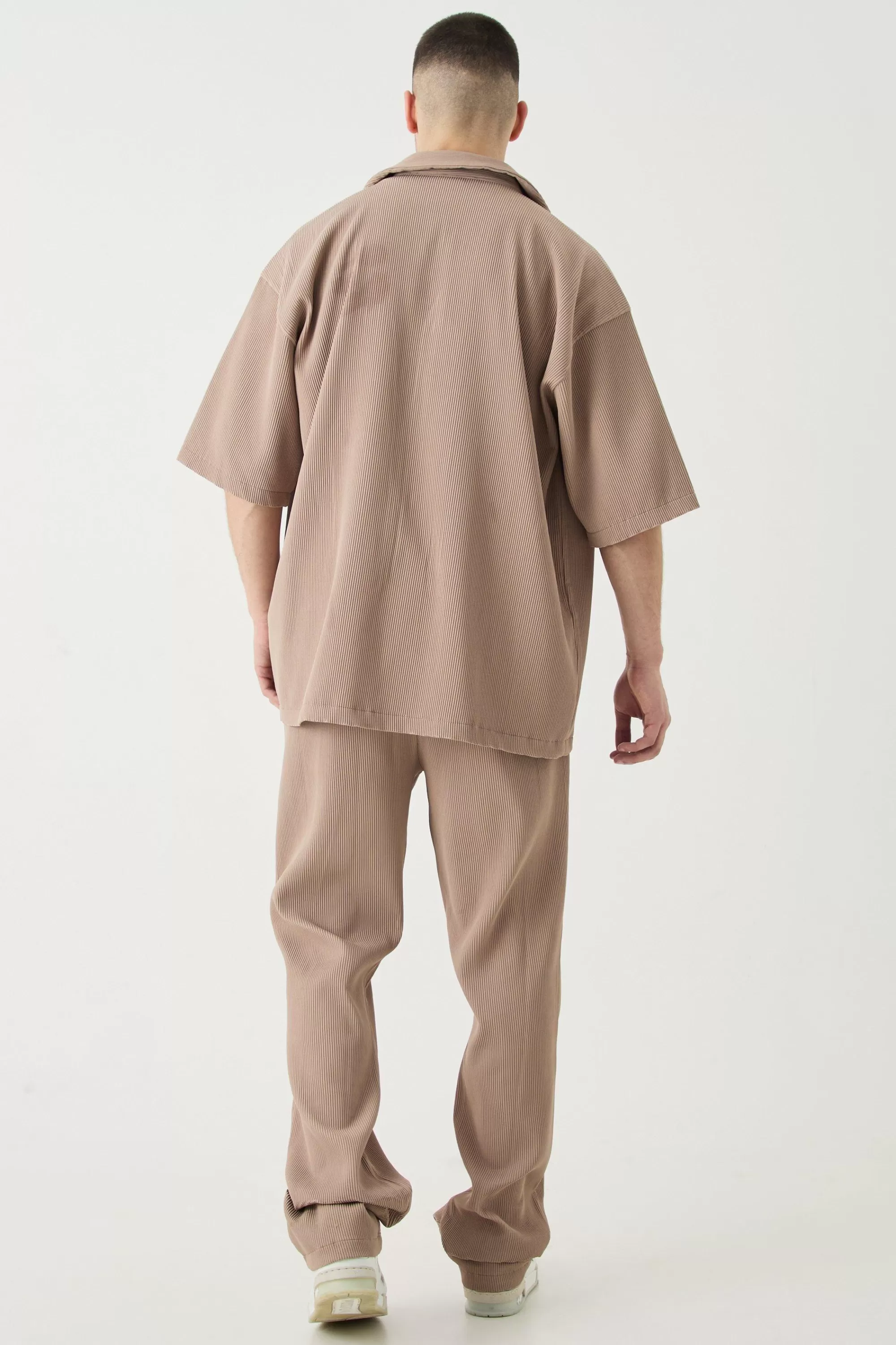 boohooMAN Tall Elasticated Waist Slim Flare Stacked Pleated Trouser | UK