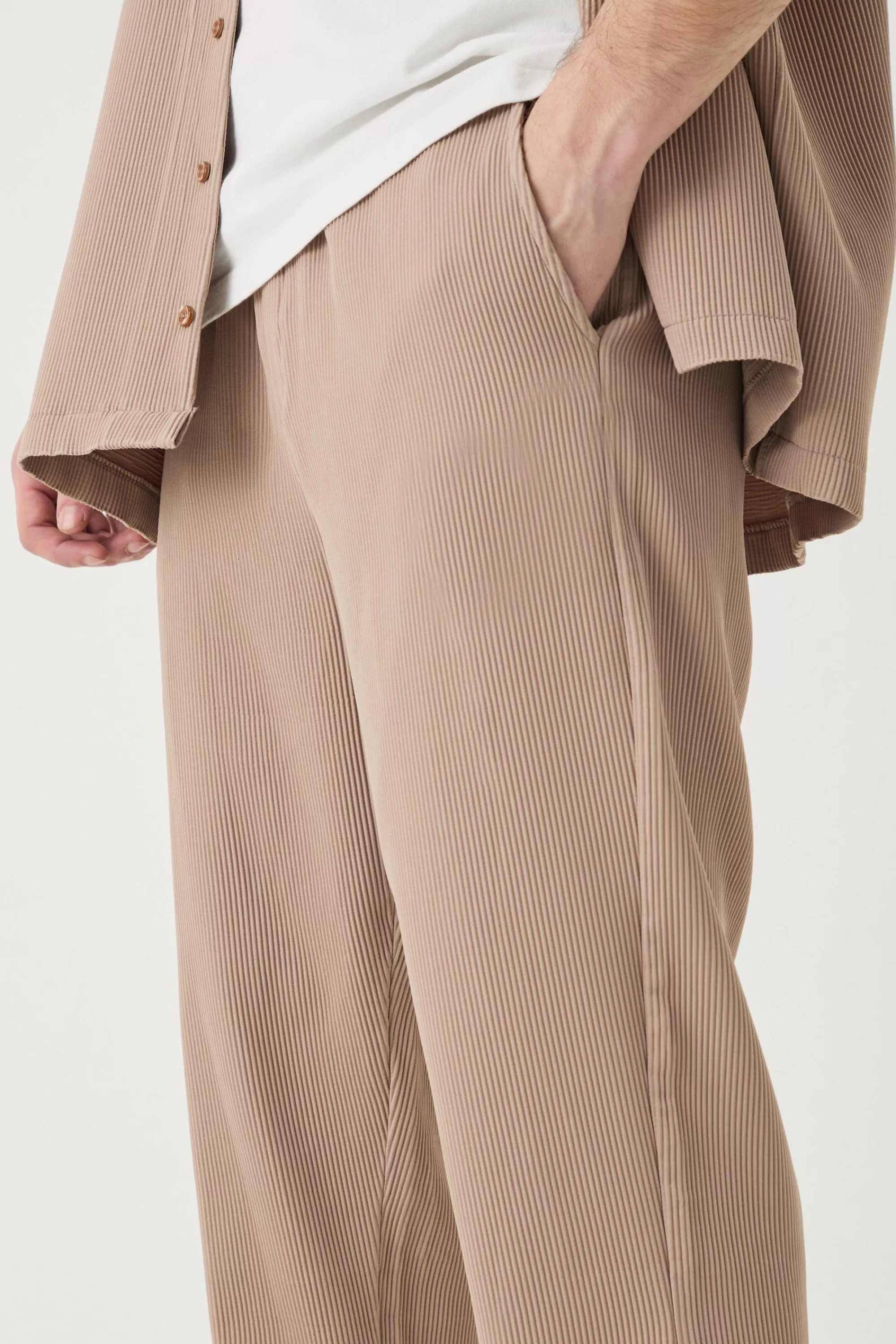 boohooMAN Tall Elasticated Waist Slim Flare Stacked Pleated Trouser | UK