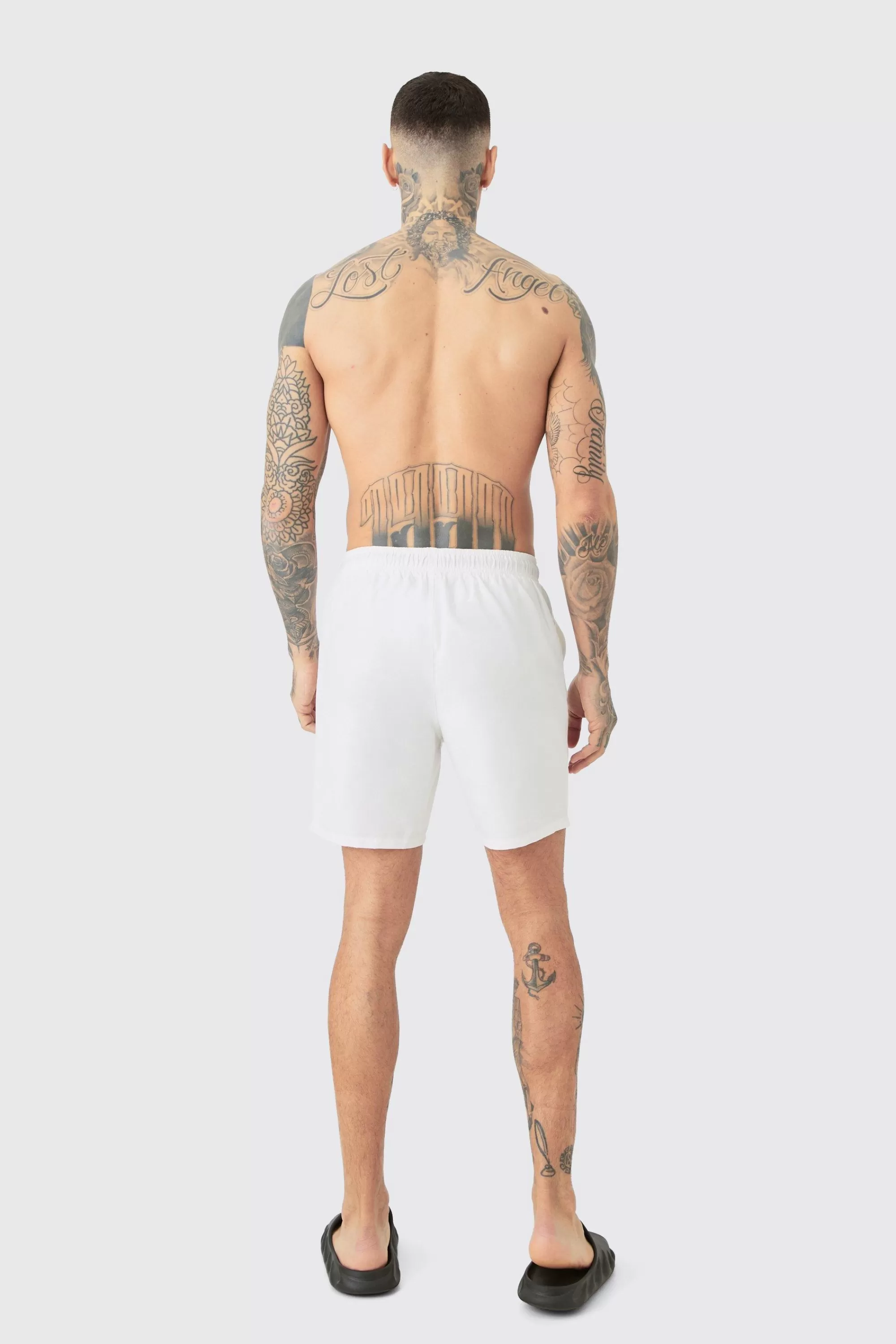 boohooMAN Tall Original Man Mid Length Swim Short | UK