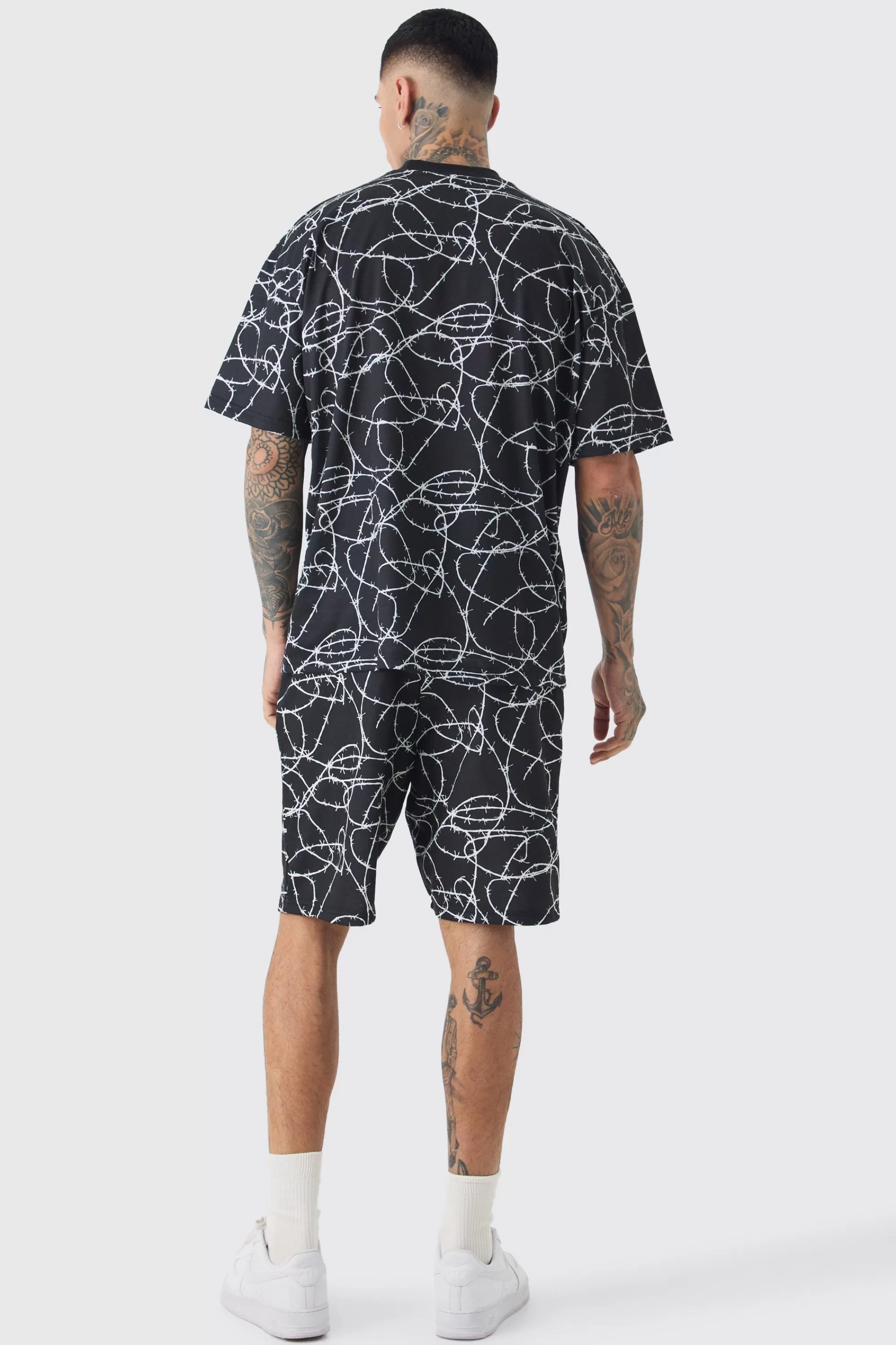 boohooMAN Tall Oversized Extended Neck Barbwire T-shirt & Short Set | UK