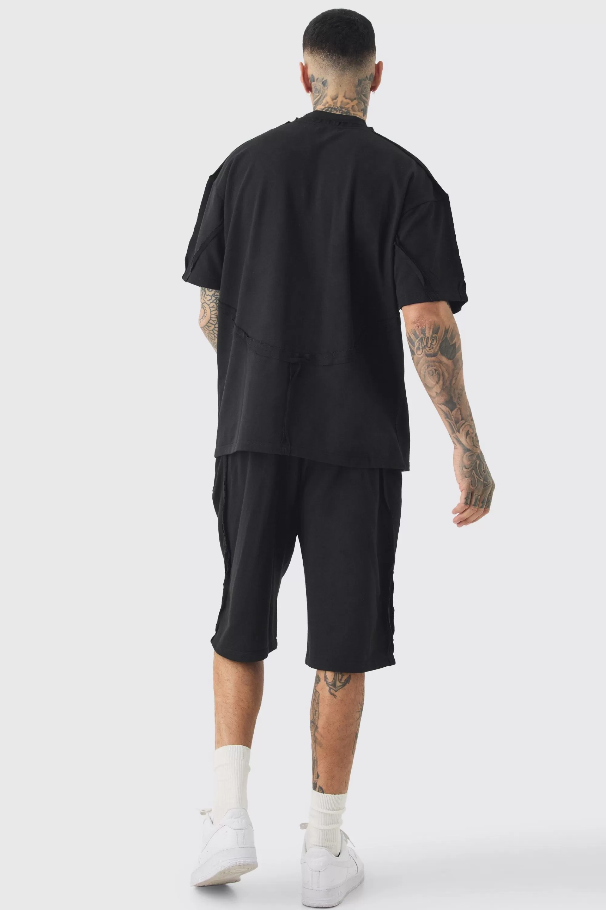 boohooMAN Tall Oversized Extended Neck Exposed Seam T-shirt & Short Set | UK