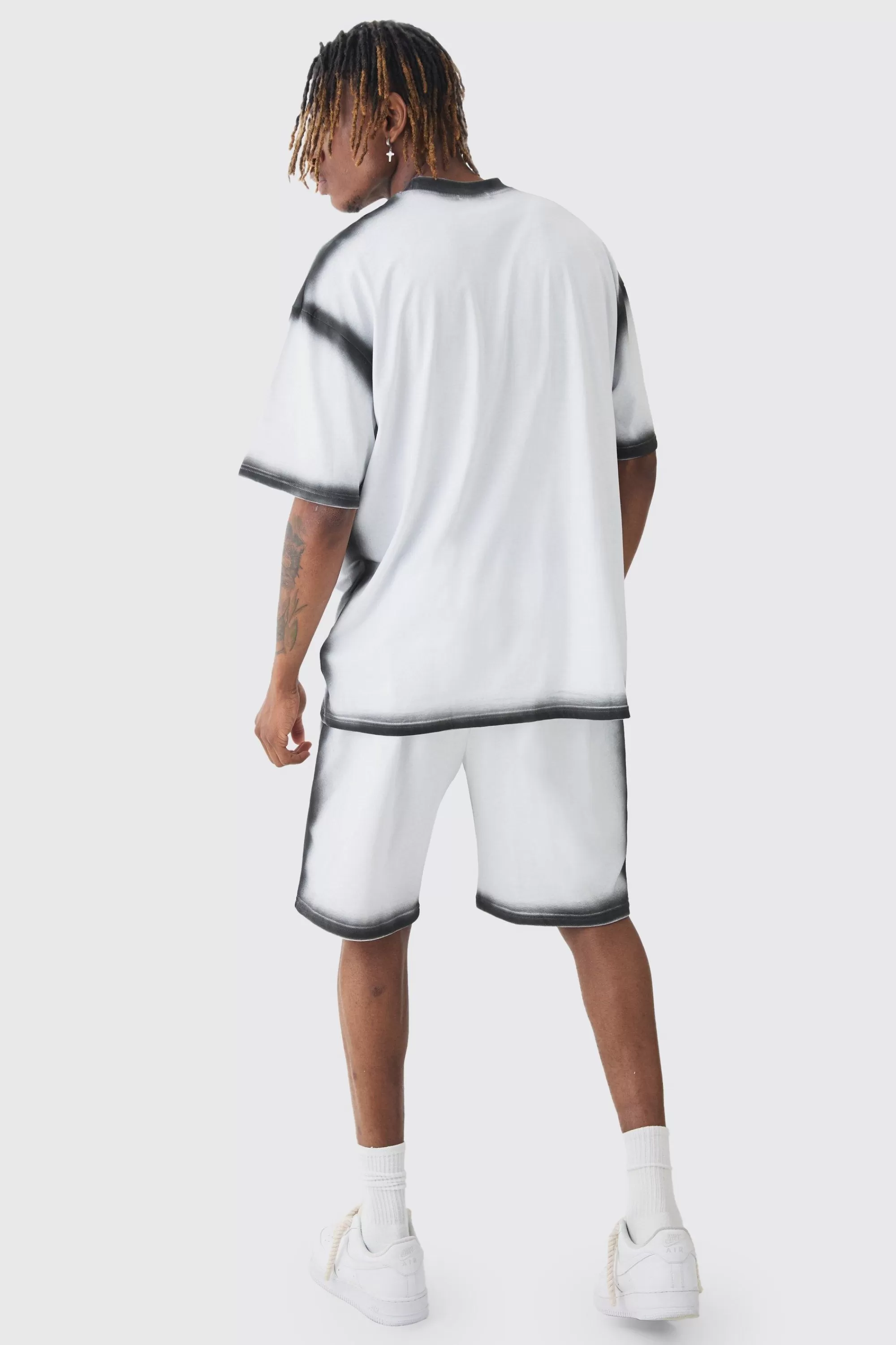 boohooMAN Tall Oversized Extended Neck Spray Wash T-shirt & Short Set | UK