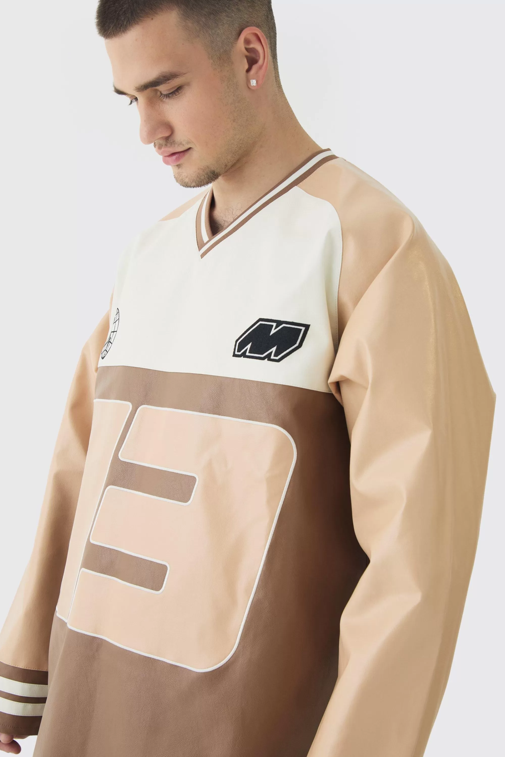 boohooMAN Tall Oversized Pu Raglan Embroidered Varsity Sweater | UK