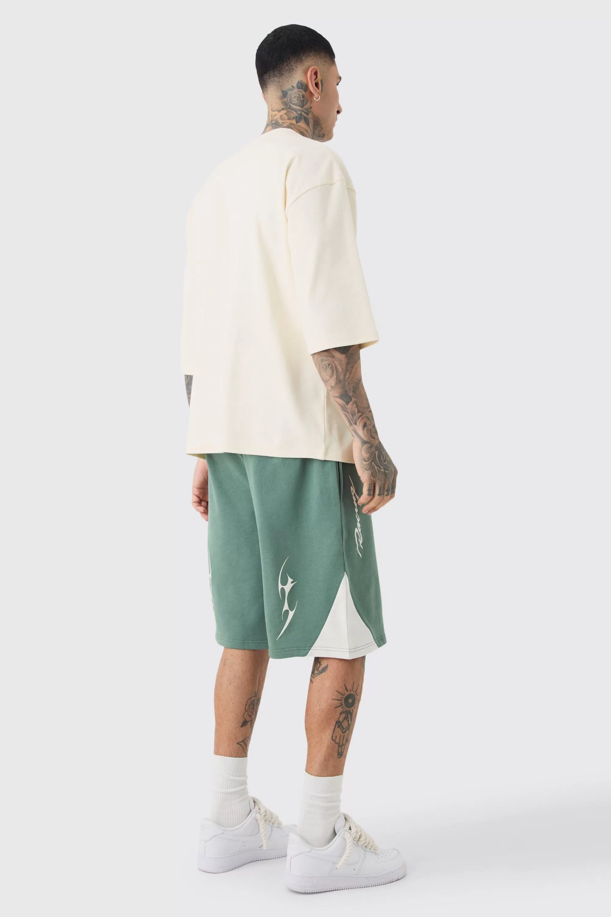 boohooMAN Tall Oversized Puff Print Moto Mid Length Shorts | UK