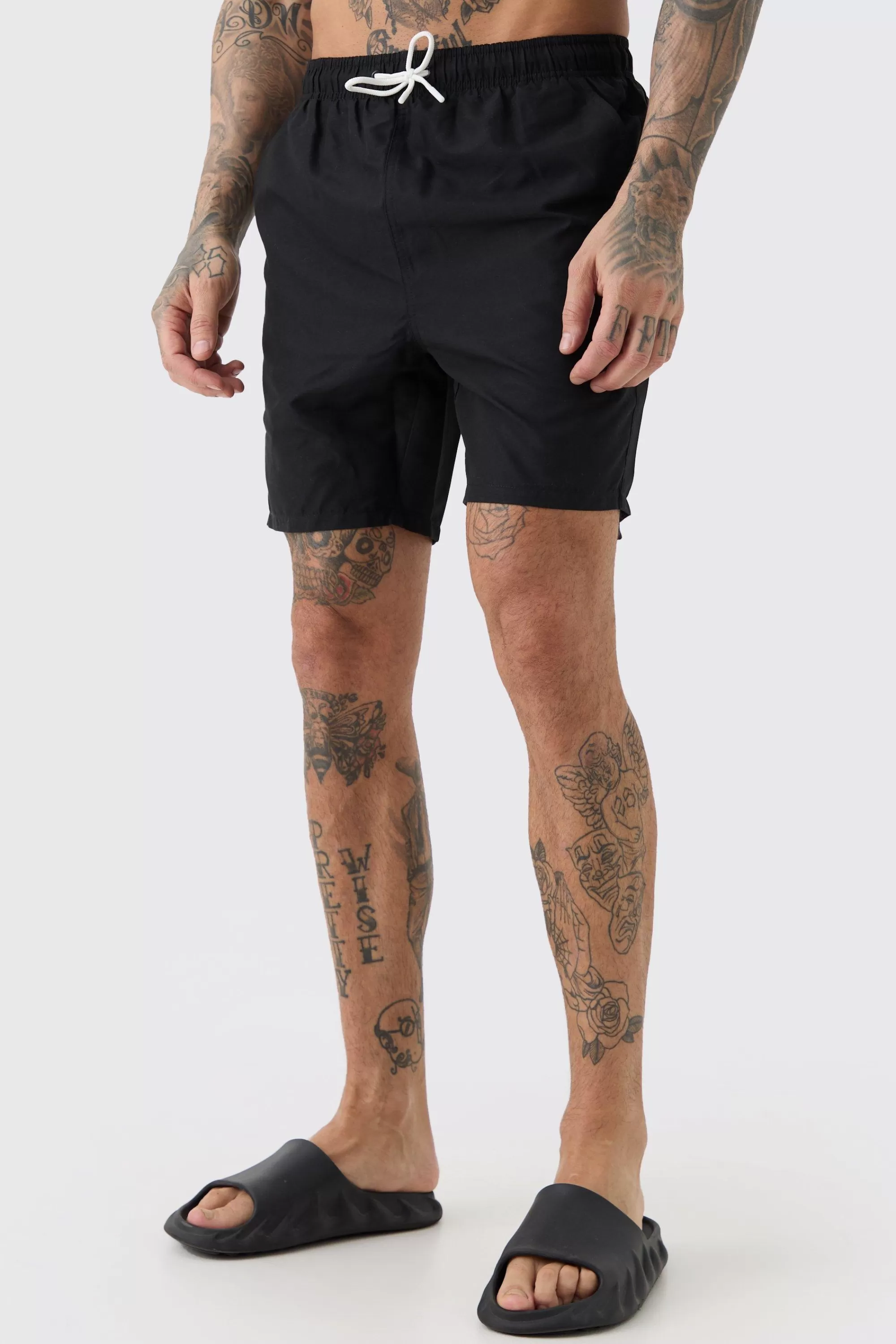 boohooMAN Tall Plain Mid Length Swim Short | UK