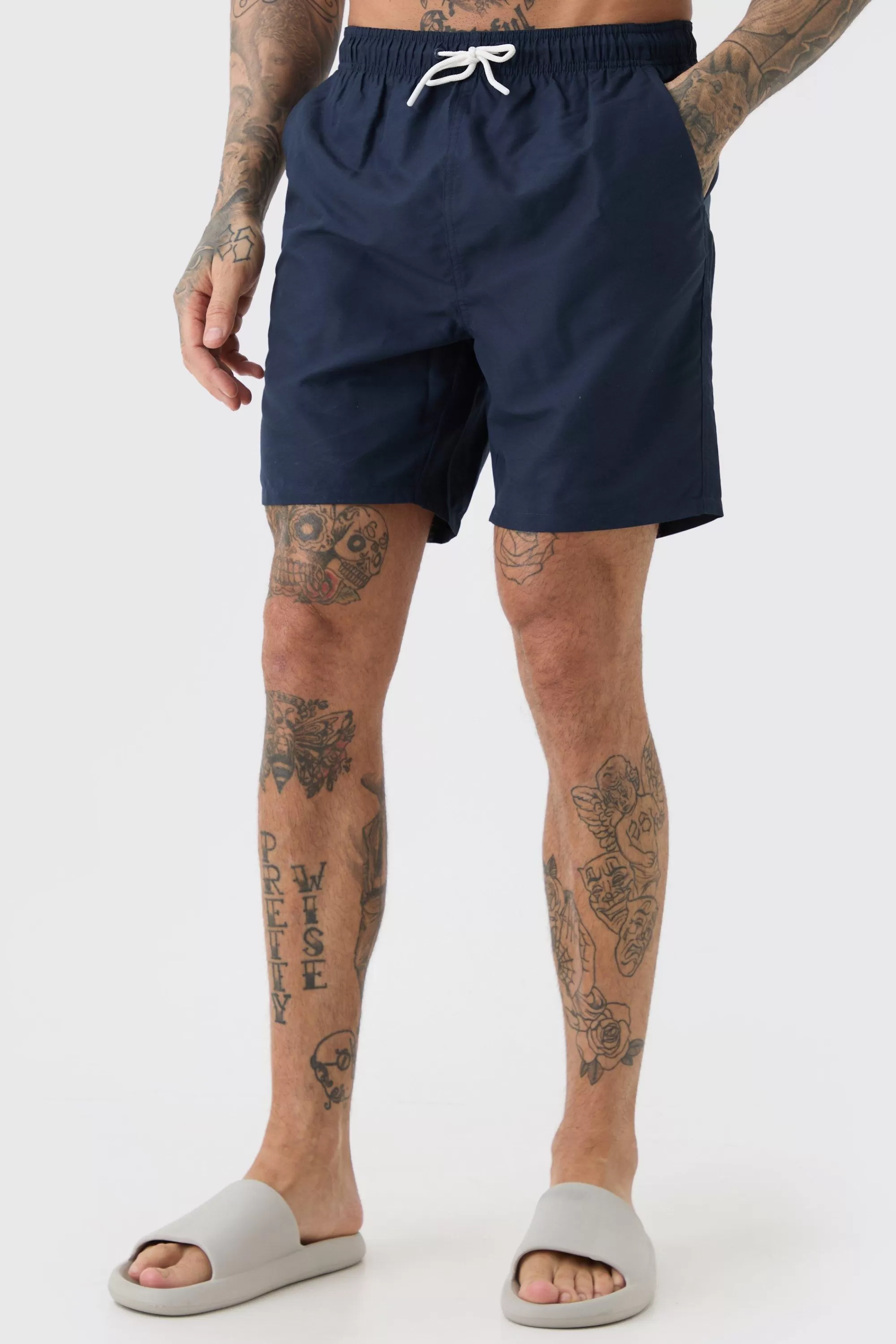 boohooMAN Tall Plain Mid Length Swim Short | UK