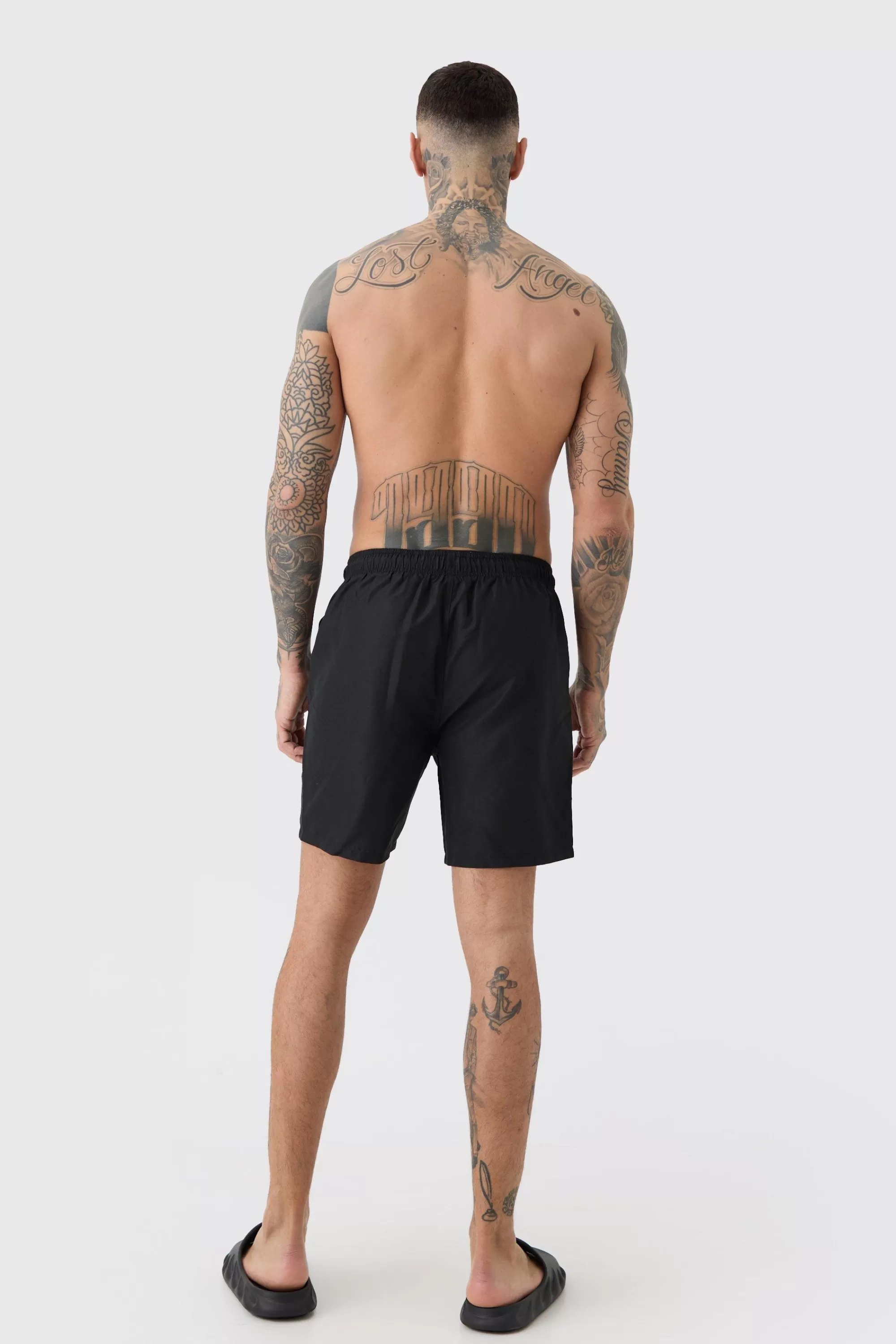 boohooMAN Tall Plain Mid Length Swim Short | UK
