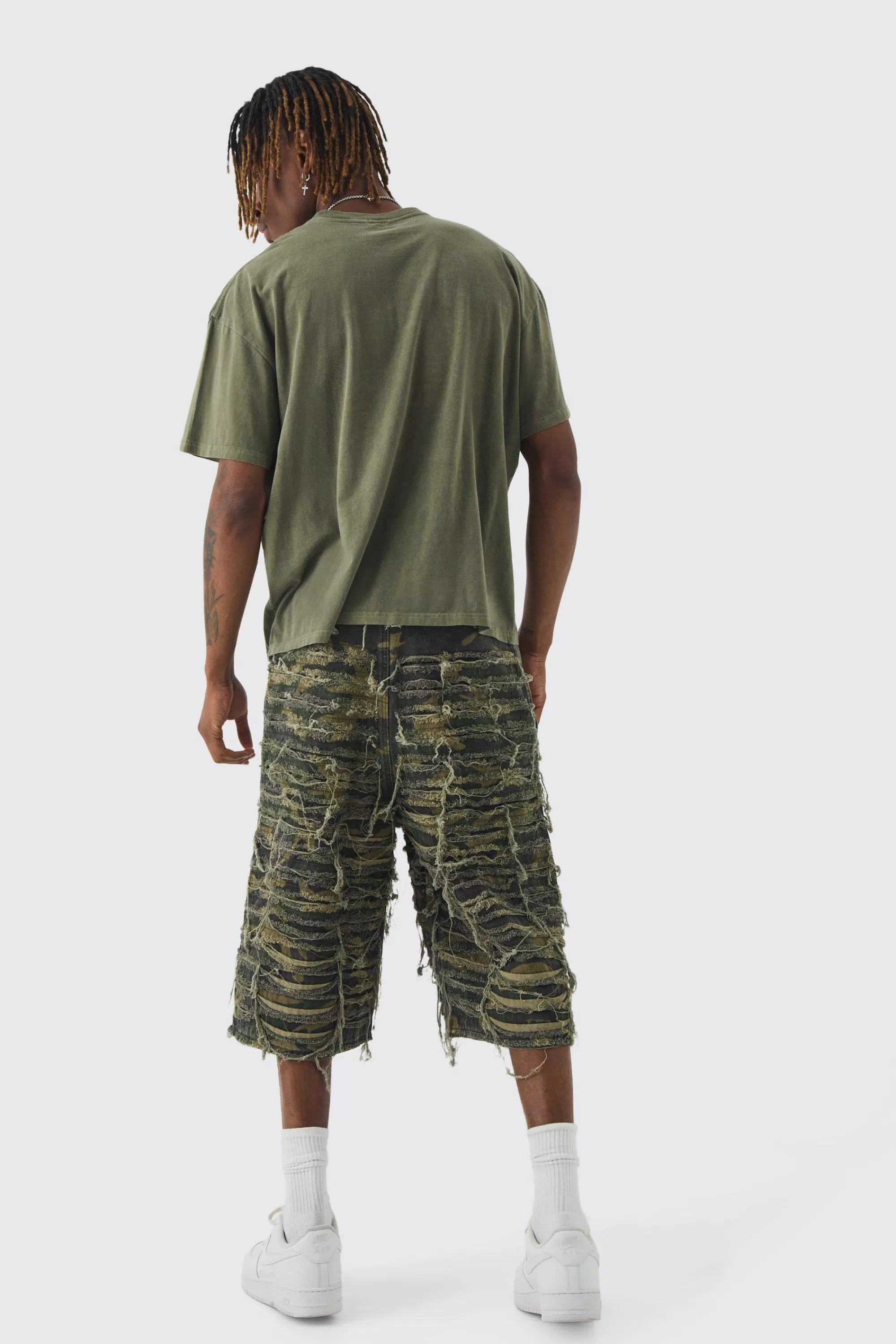 boohooMAN Tall Relaxed Heavily Distressed Camo Jort | UK