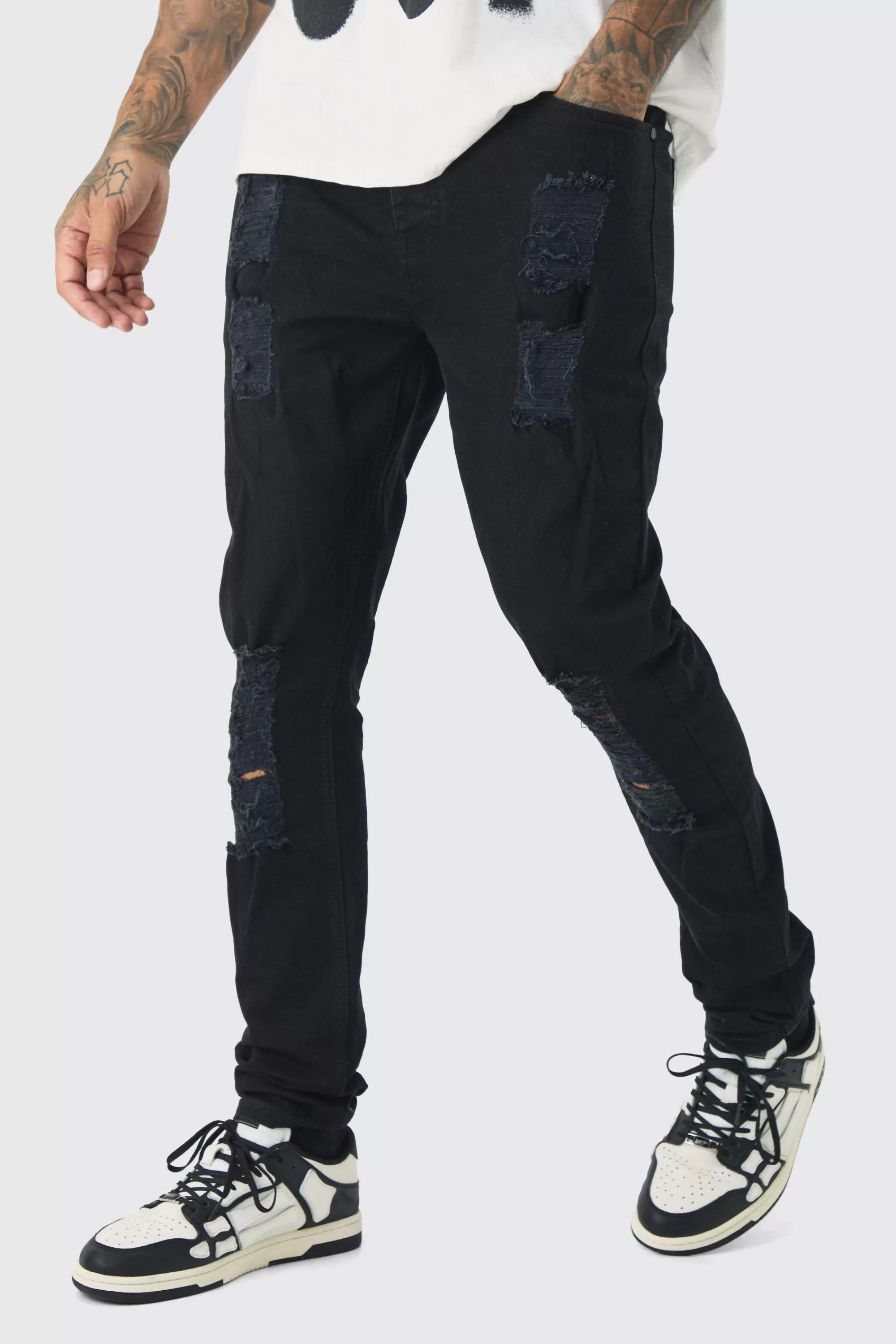 boohooMAN Tall Skinny Jeans With All Over Rips | UK