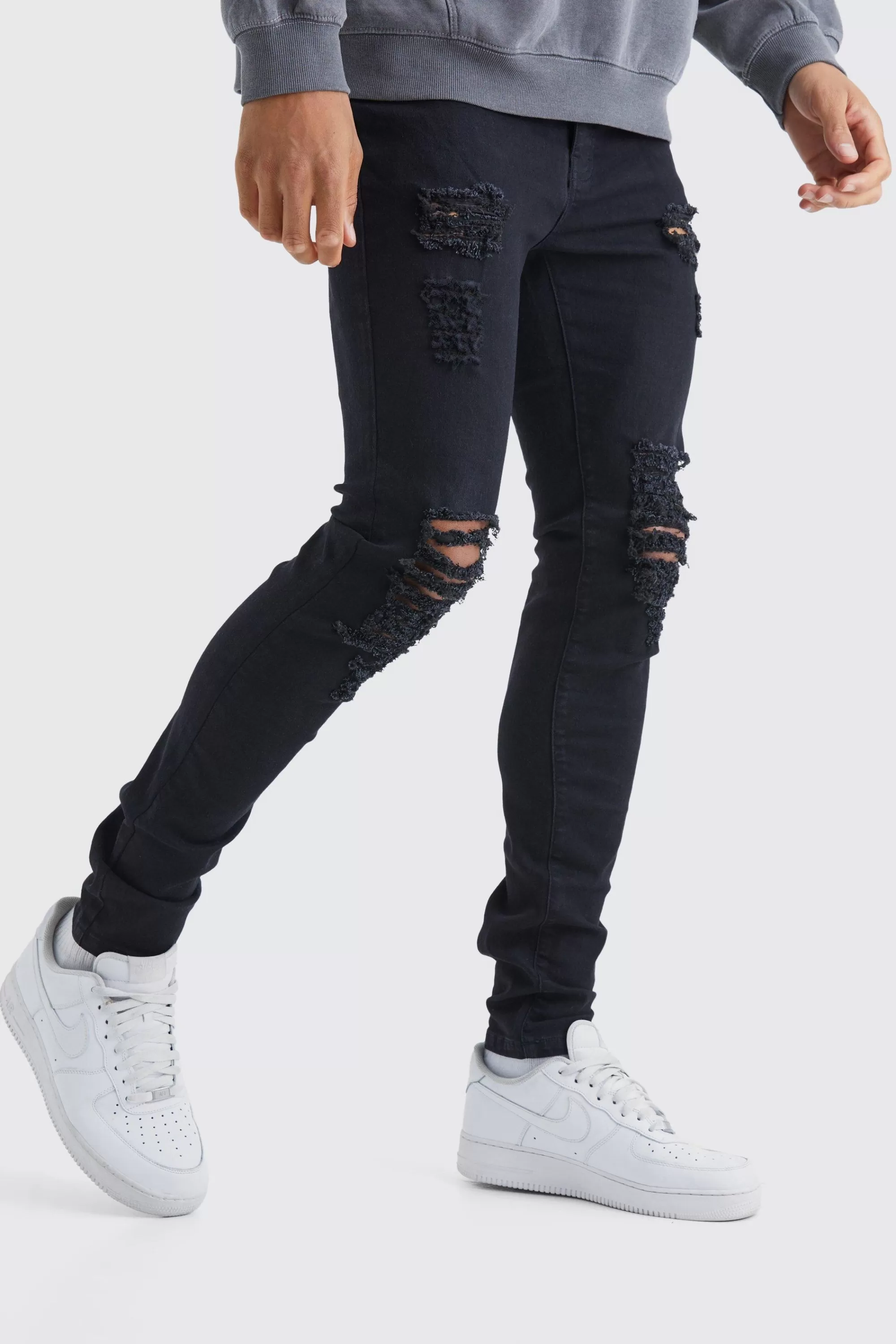 boohooMAN Tall Skinny Jeans With All Over Rips | UK