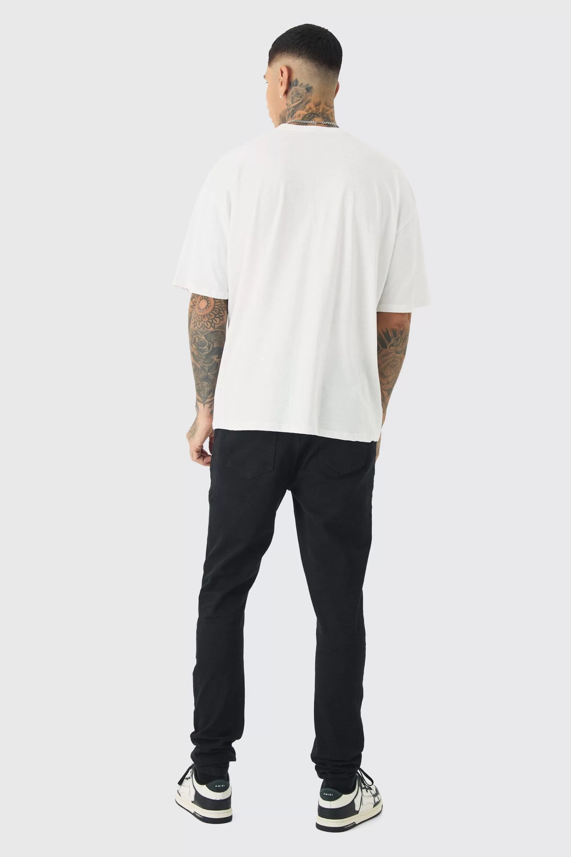 boohooMAN Tall Skinny Jeans With All Over Rips | UK