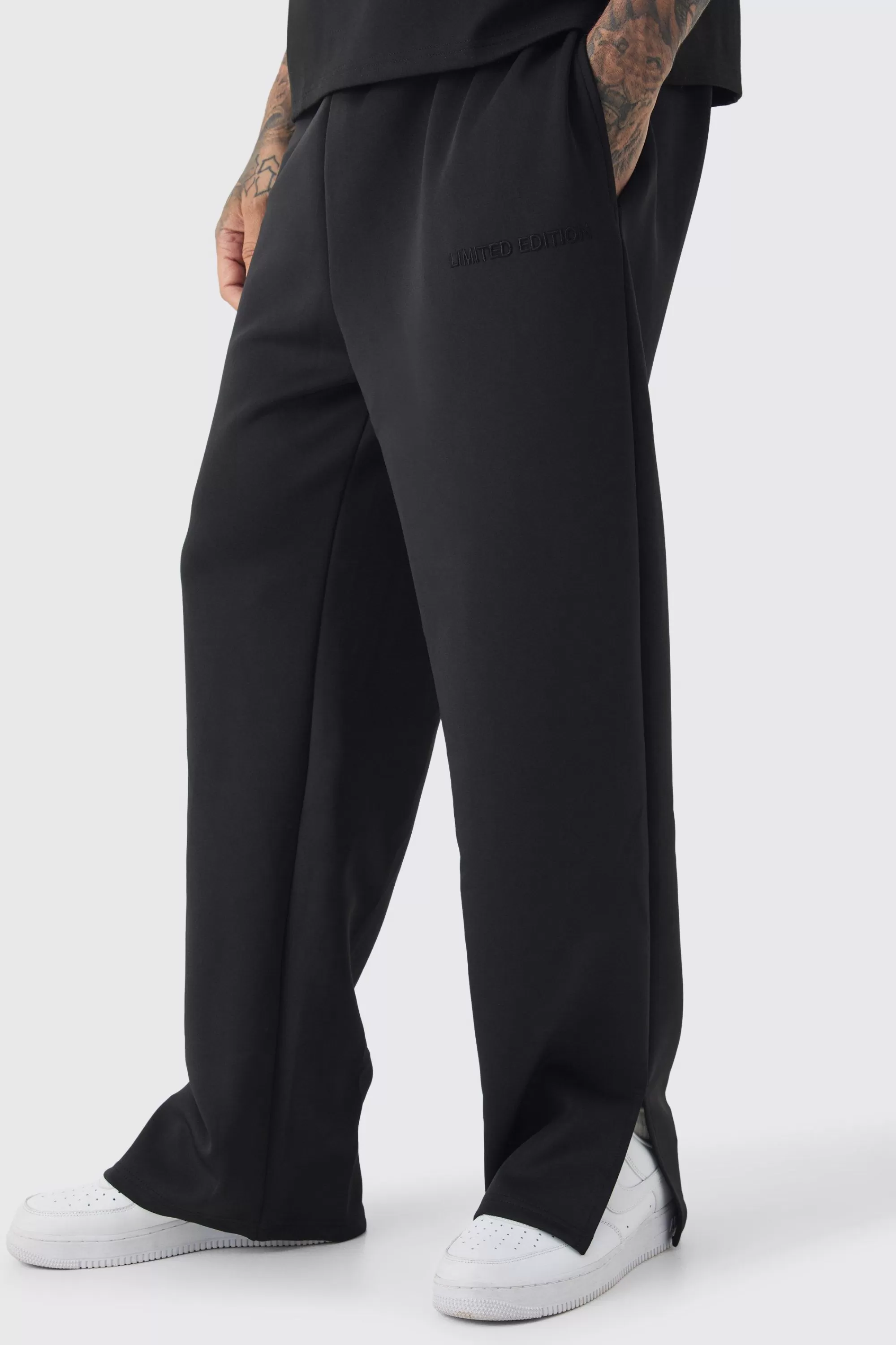 boohooMAN Tall Tricot Embroidered Split Hem Relaxed Fit Trousers | UK