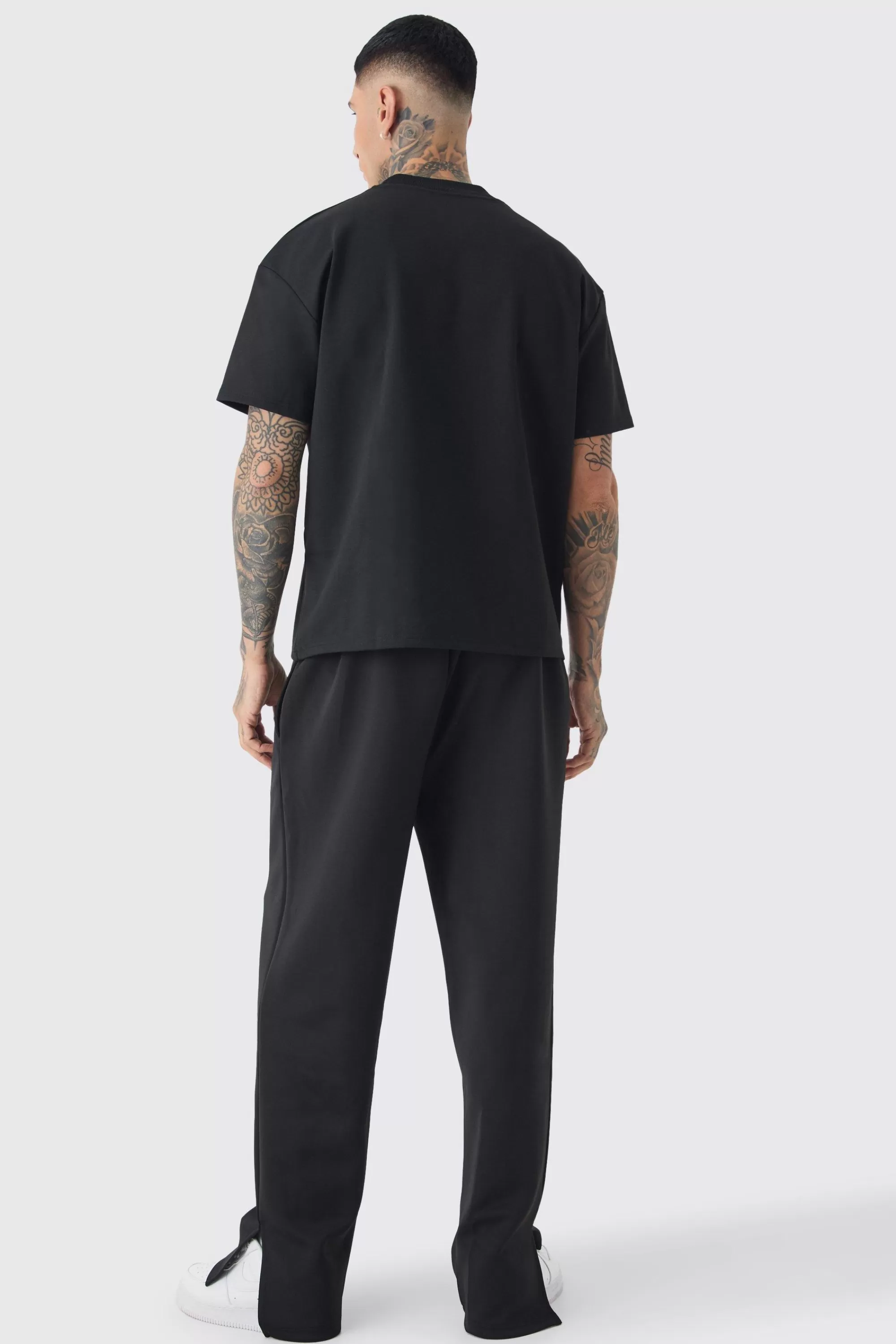 boohooMAN Tall Tricot Embroidered Split Hem Relaxed Fit Trousers | UK