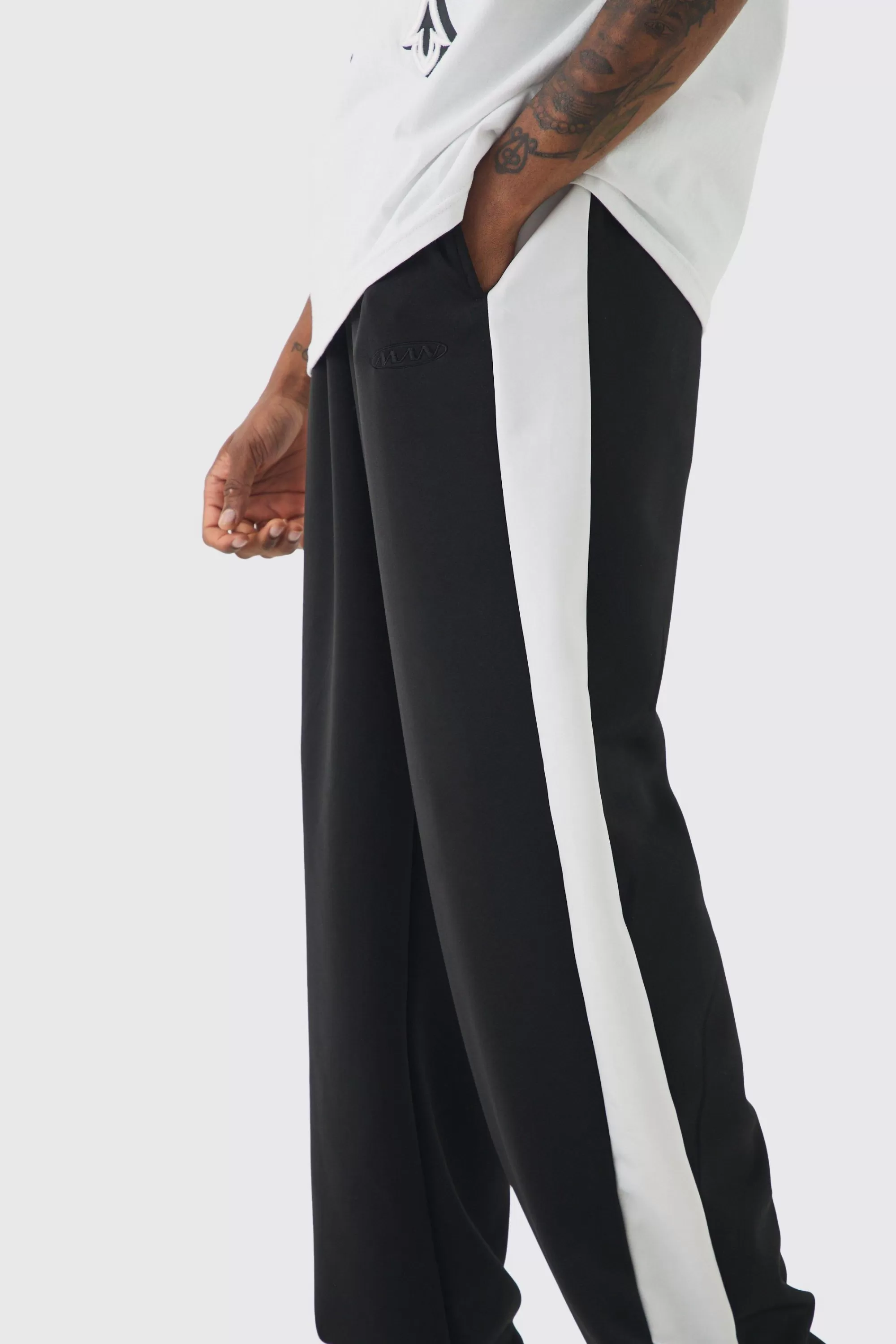 boohooMAN Tall Tricot Side Panel Embroidered Relaxed Fit Trousers | UK