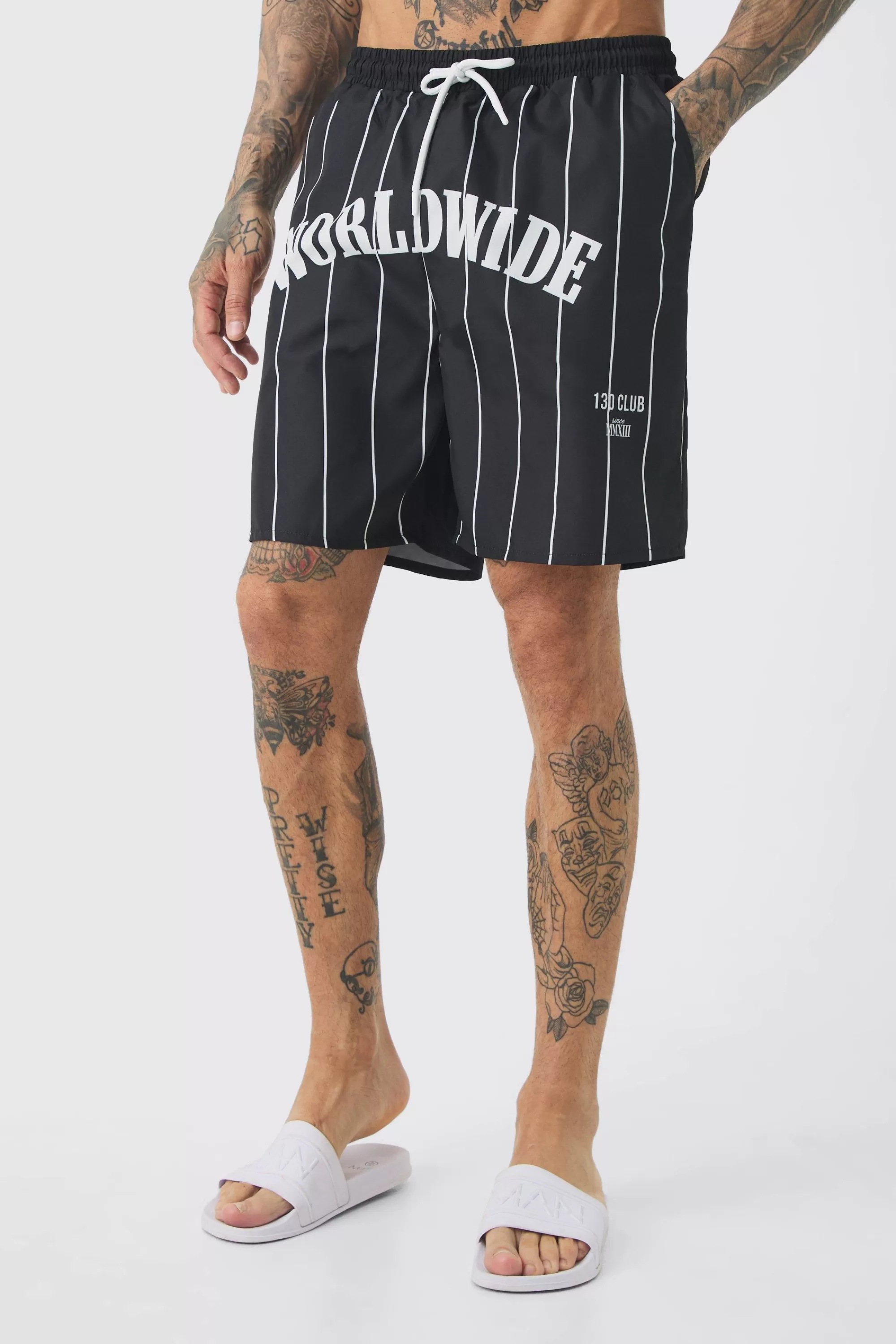 boohooMAN Tall Worldwide Crotch Printed Stripe Swim Shorts | UK