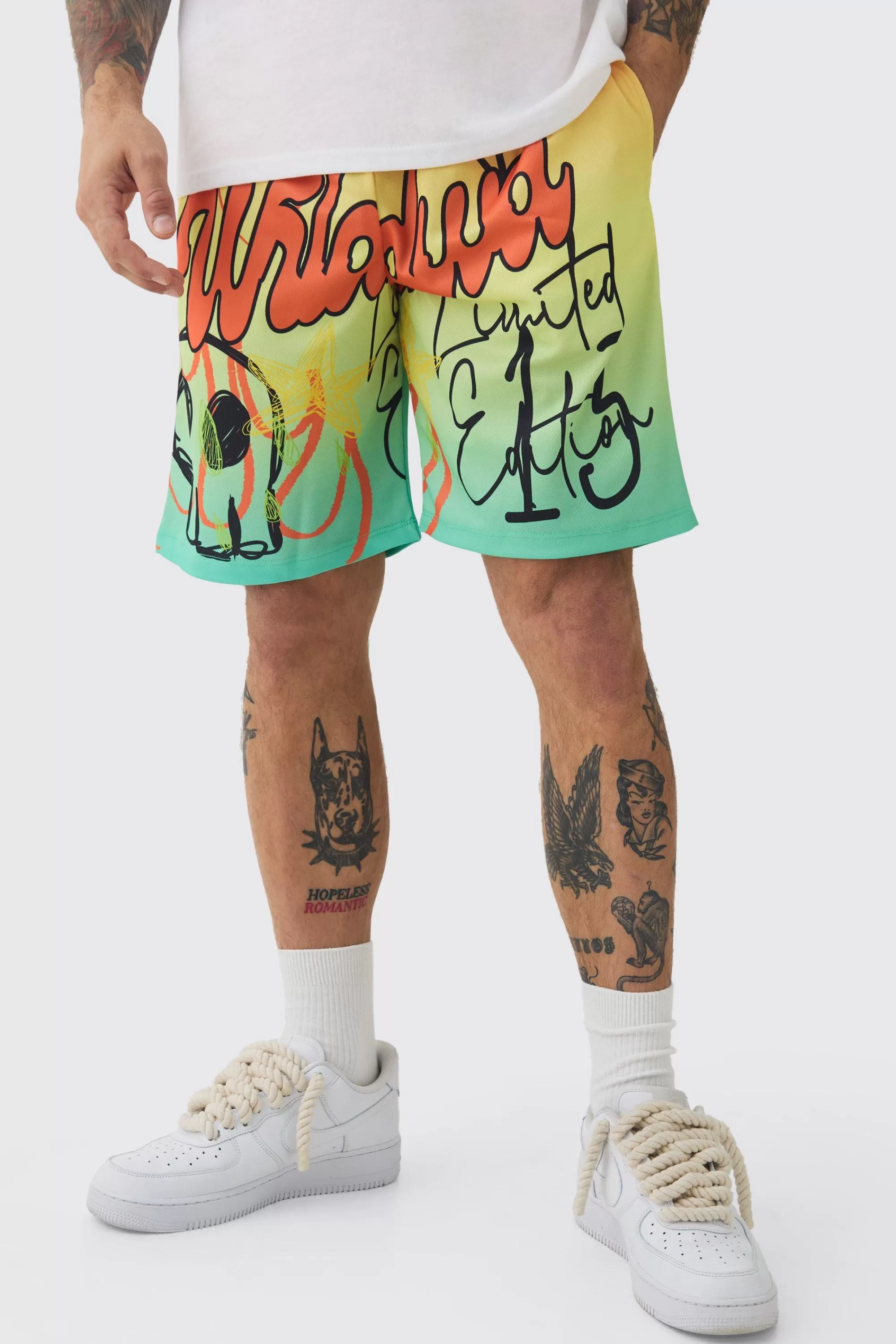 boohooMAN Worldwide Graffiti Mesh Mid Length Basketball Shorts | UK