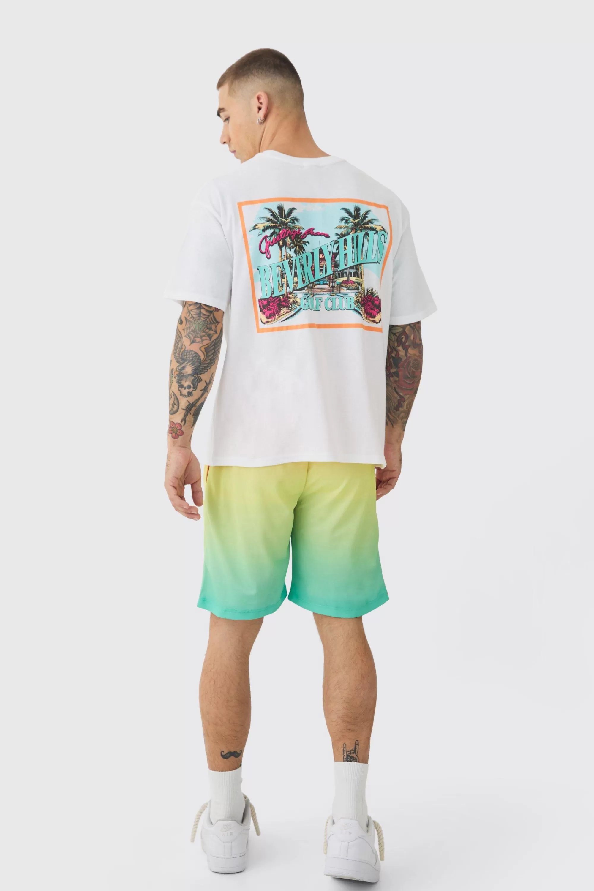 boohooMAN Worldwide Graffiti Mesh Mid Length Basketball Shorts | UK