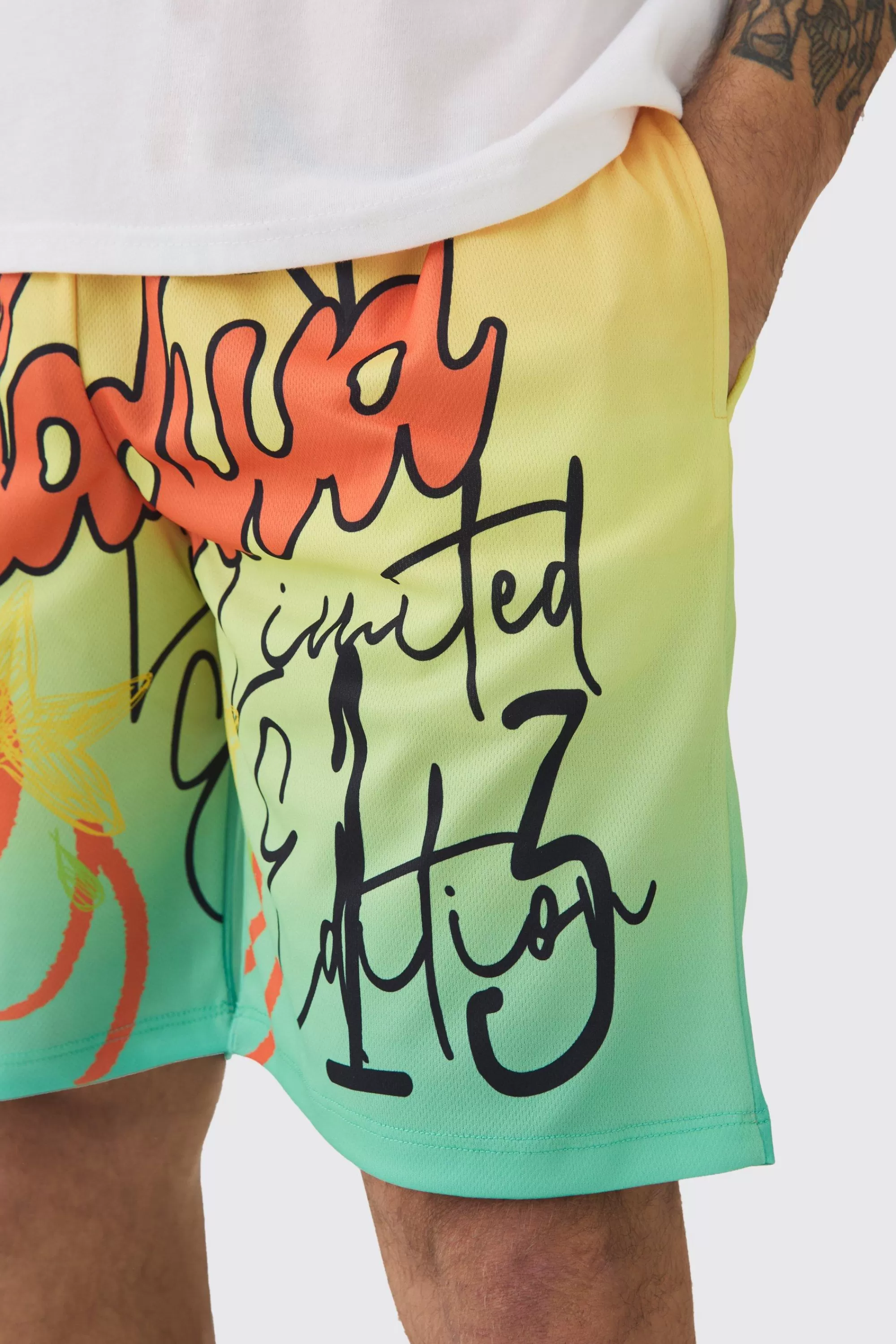 boohooMAN Worldwide Graffiti Mesh Mid Length Basketball Shorts | UK
