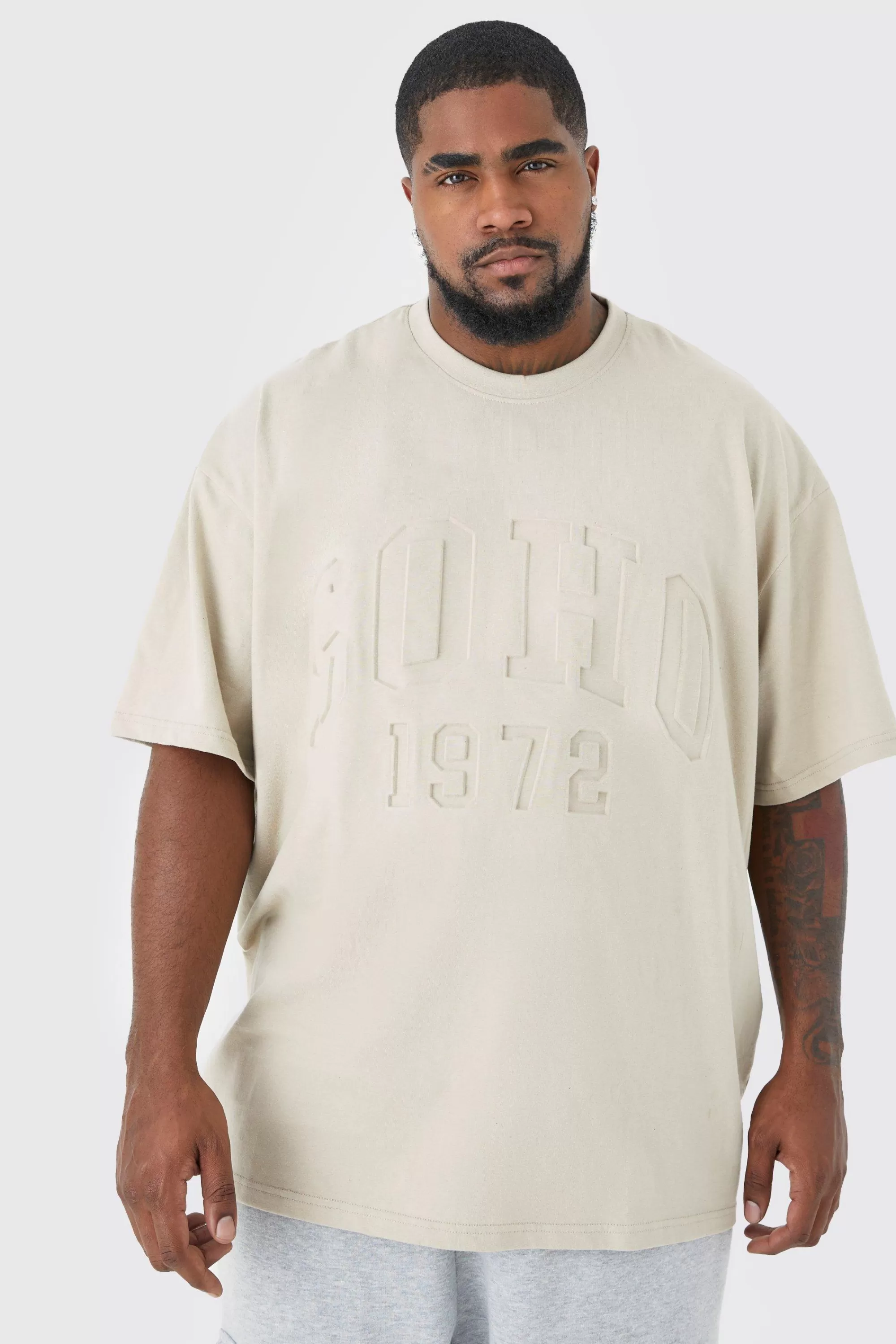 boohooMAN Plus Oversized Soho Varsity Debossed T-shirt | UK stone Hot