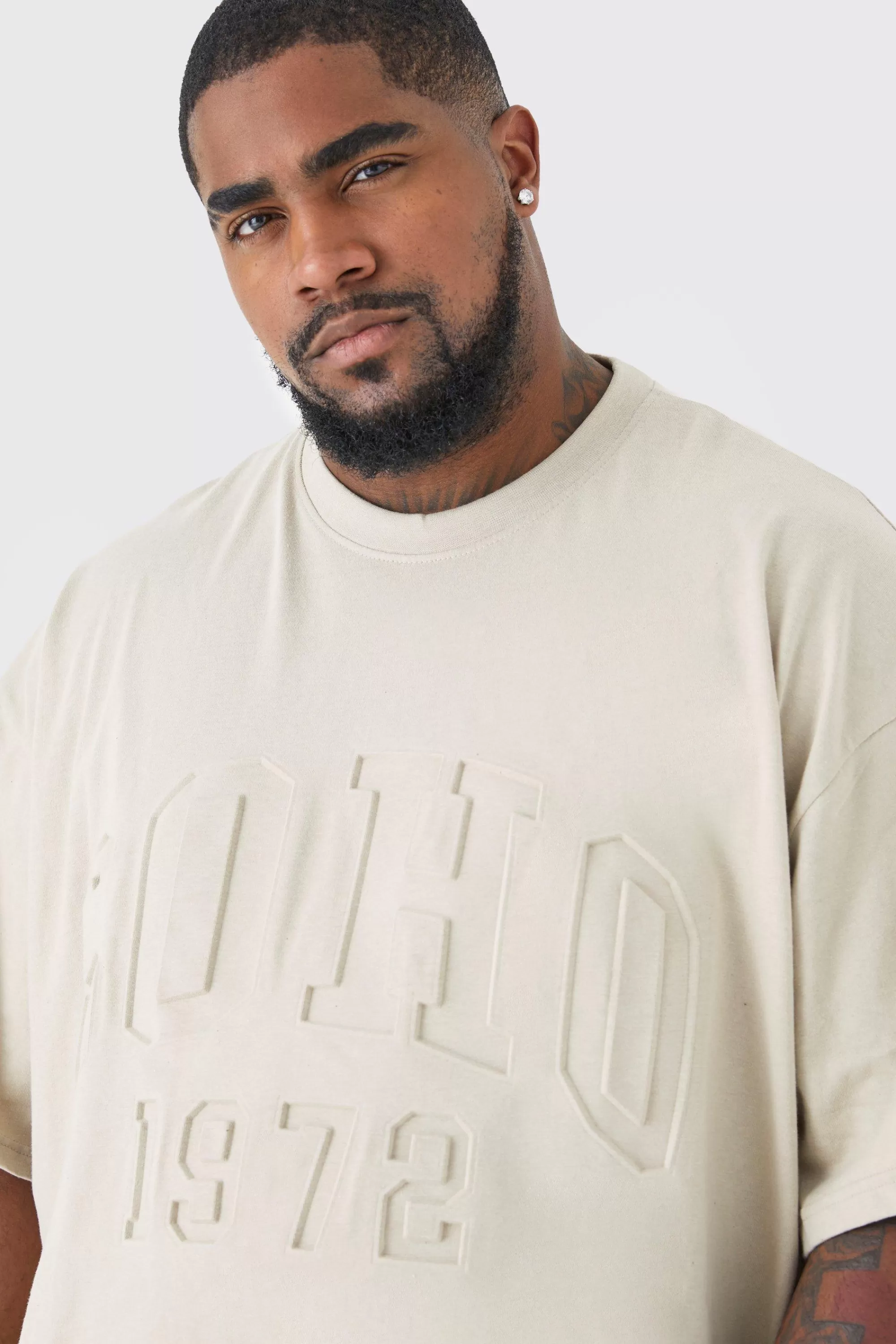 boohooMAN Plus Oversized Soho Varsity Debossed T-shirt | UK stone Hot
