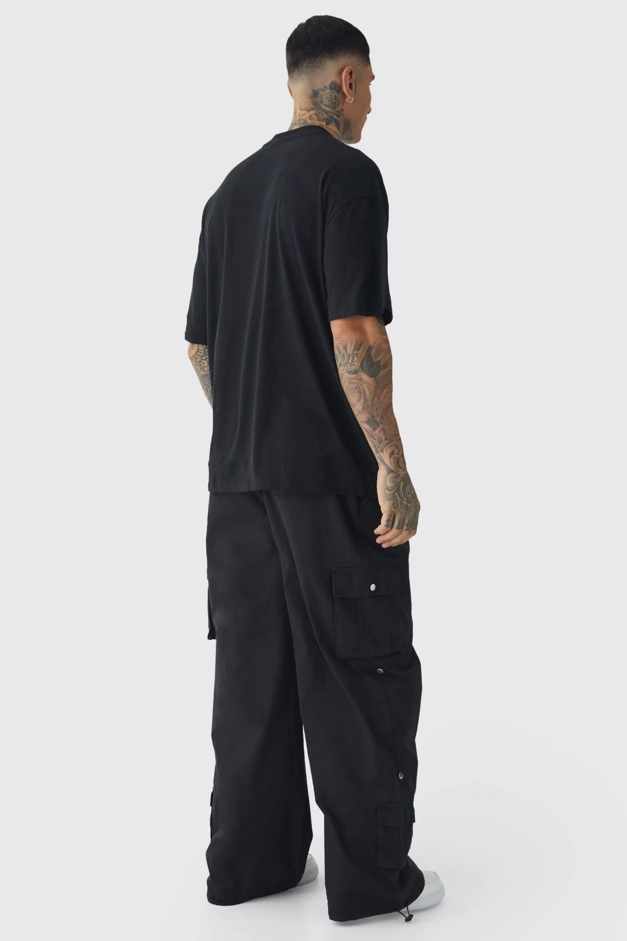 boohooMAN Tall Oversized Extended Neck Limited Large Scale Print T-Shirt | UK black Shop